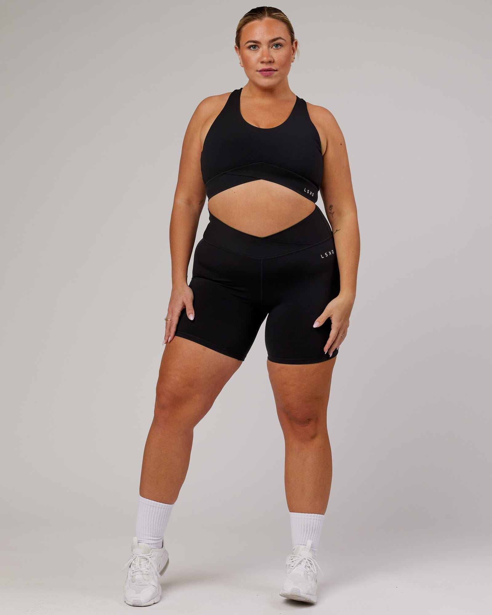 Model wearing Strike Mid Short Tight - Black