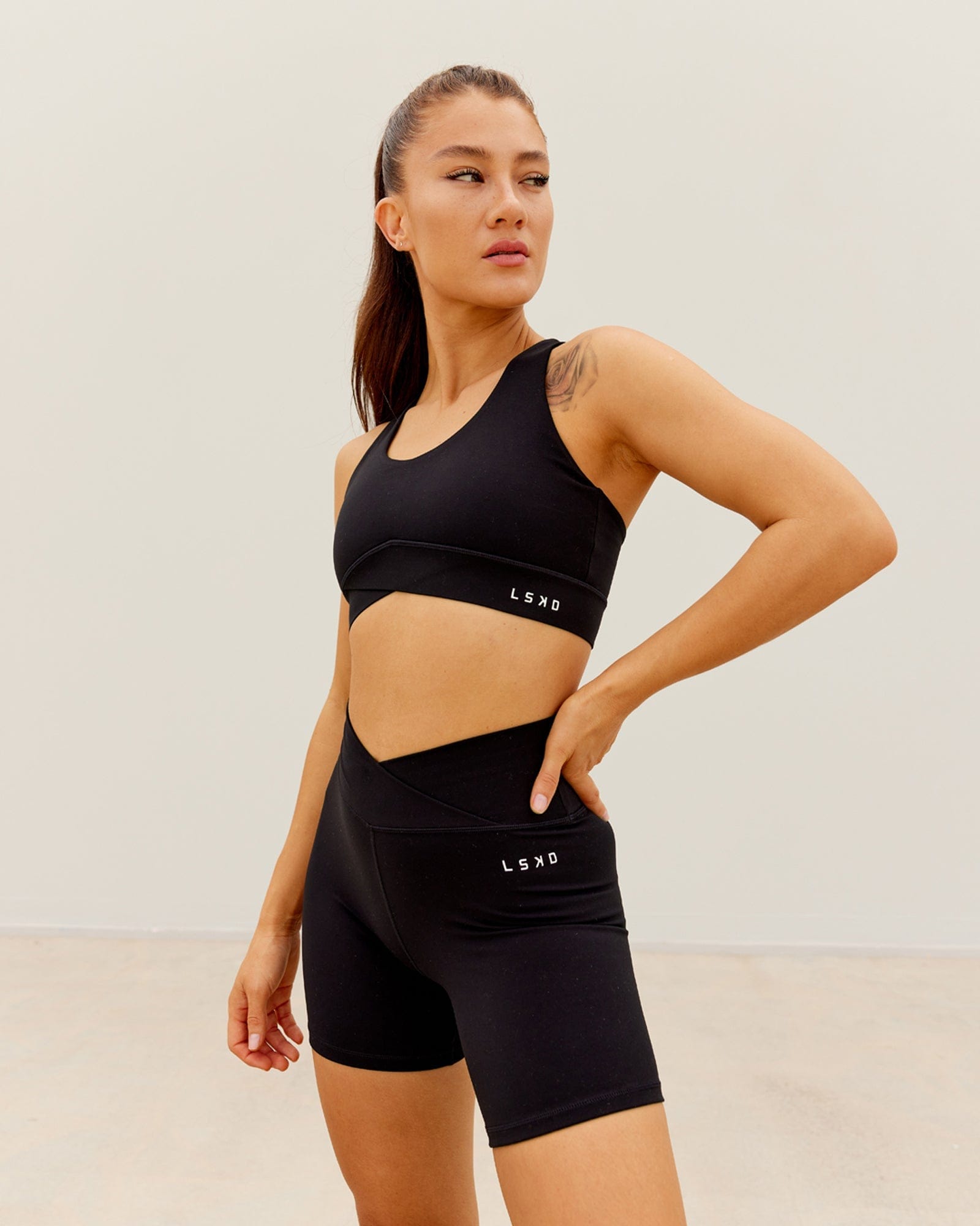 Model wearing Strike Mid Short Tight - Black