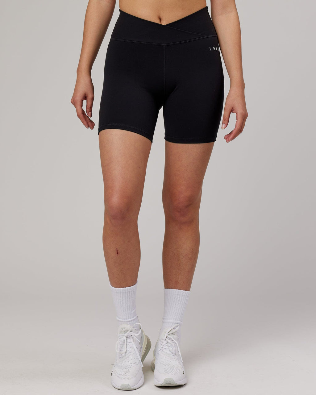 Model wearing Strike Mid Short Tight - Black