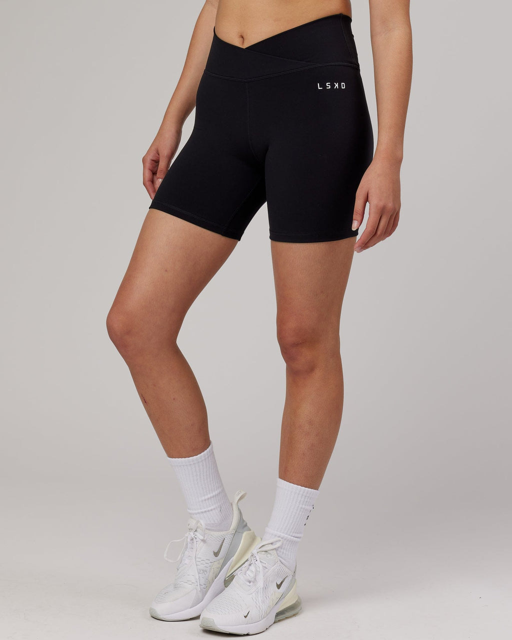 Model wearing Strike Mid Short Tight - Black
