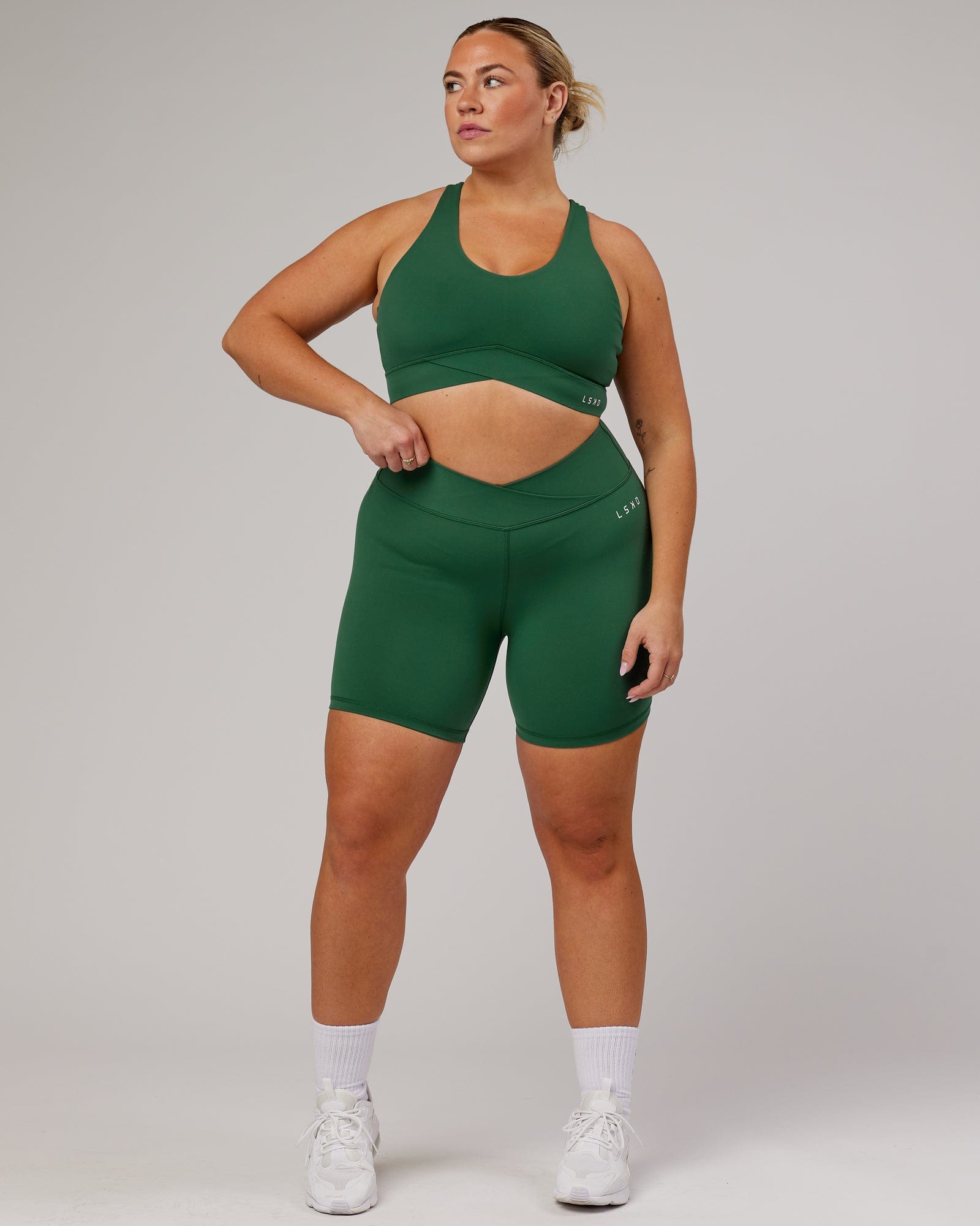 Model wearing Strike Mid Short Tight - Pineneedle