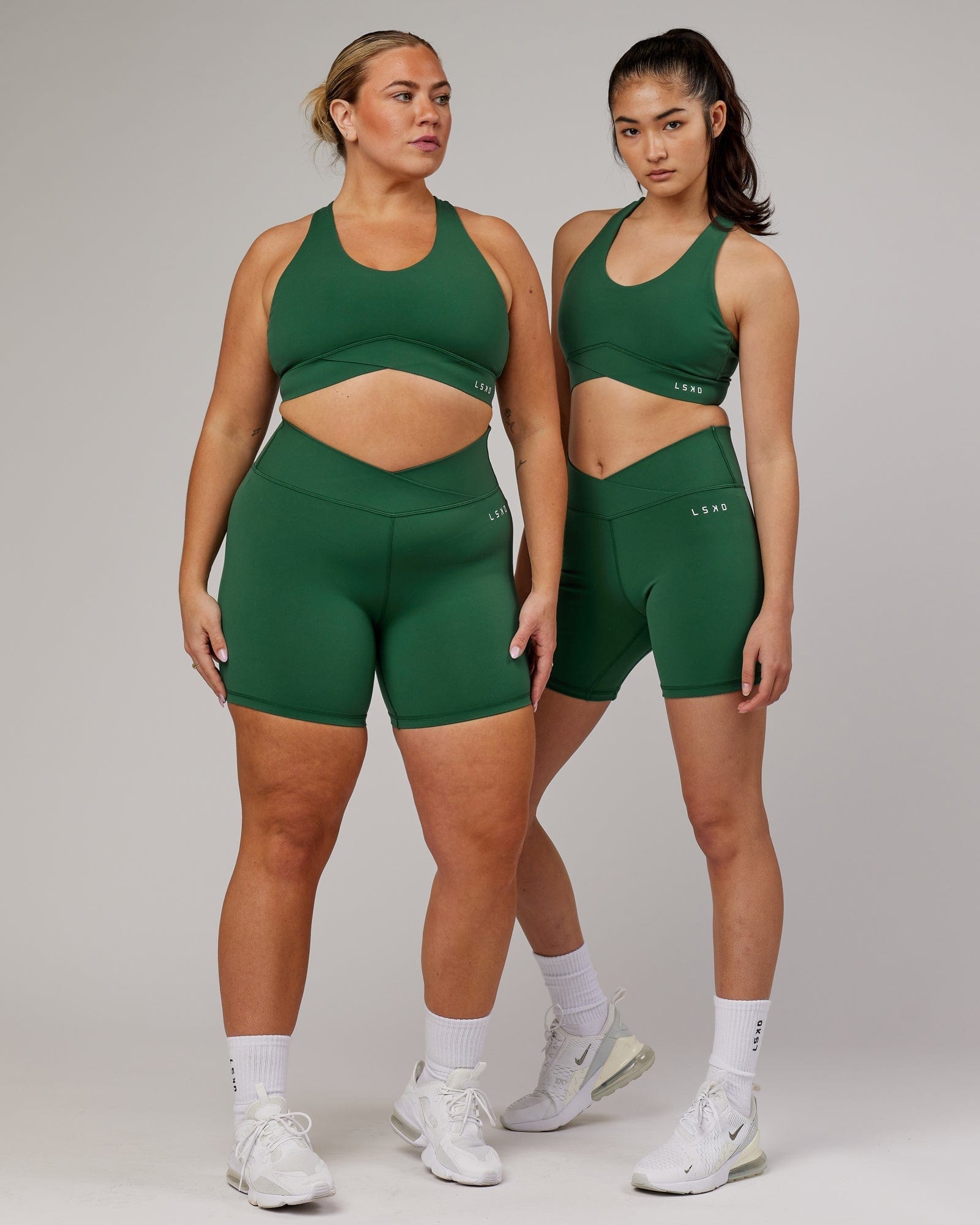 Model wearing Strike Mid Short Tight - Pineneedle