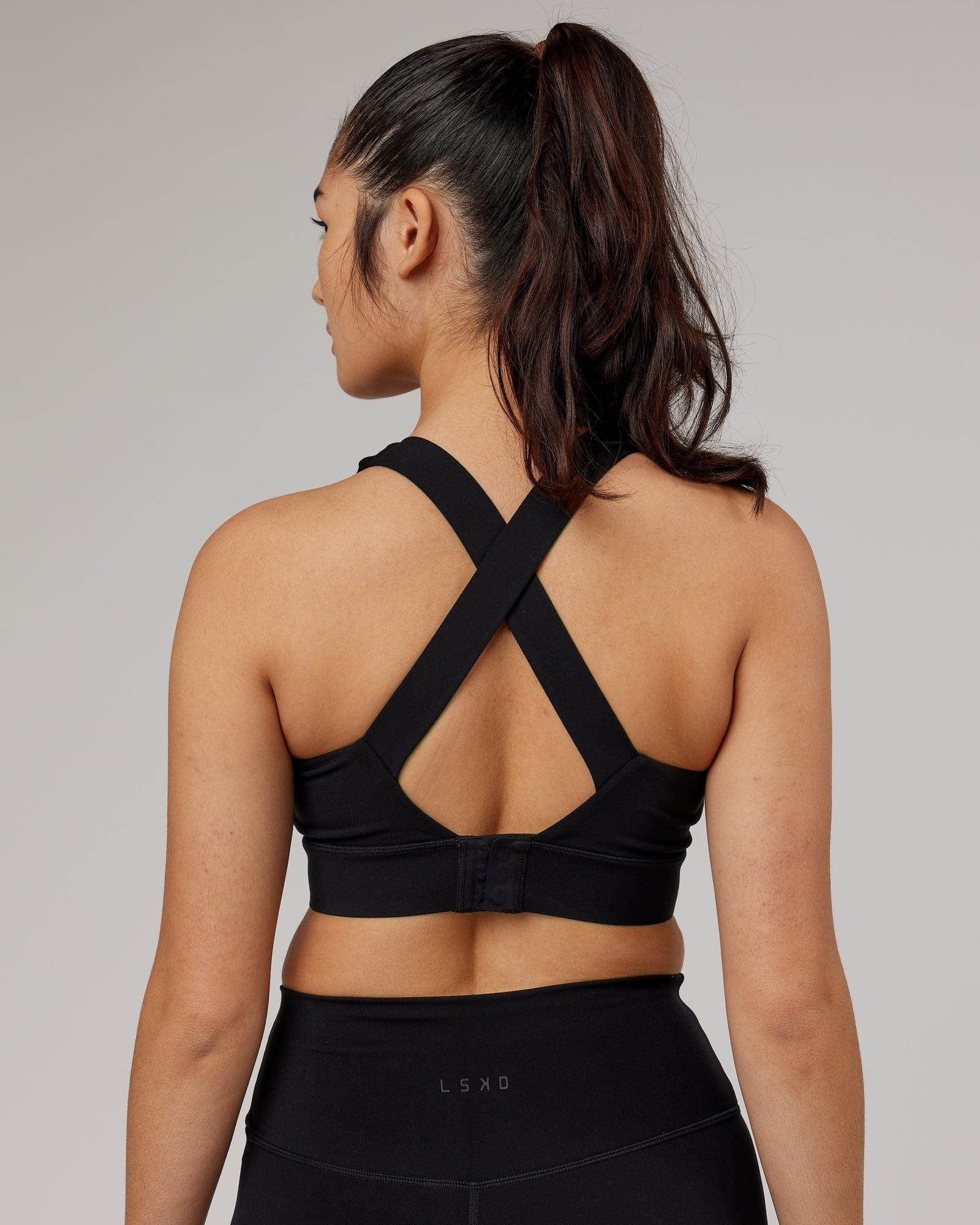 Model wearing Strike Sports Bra - Black