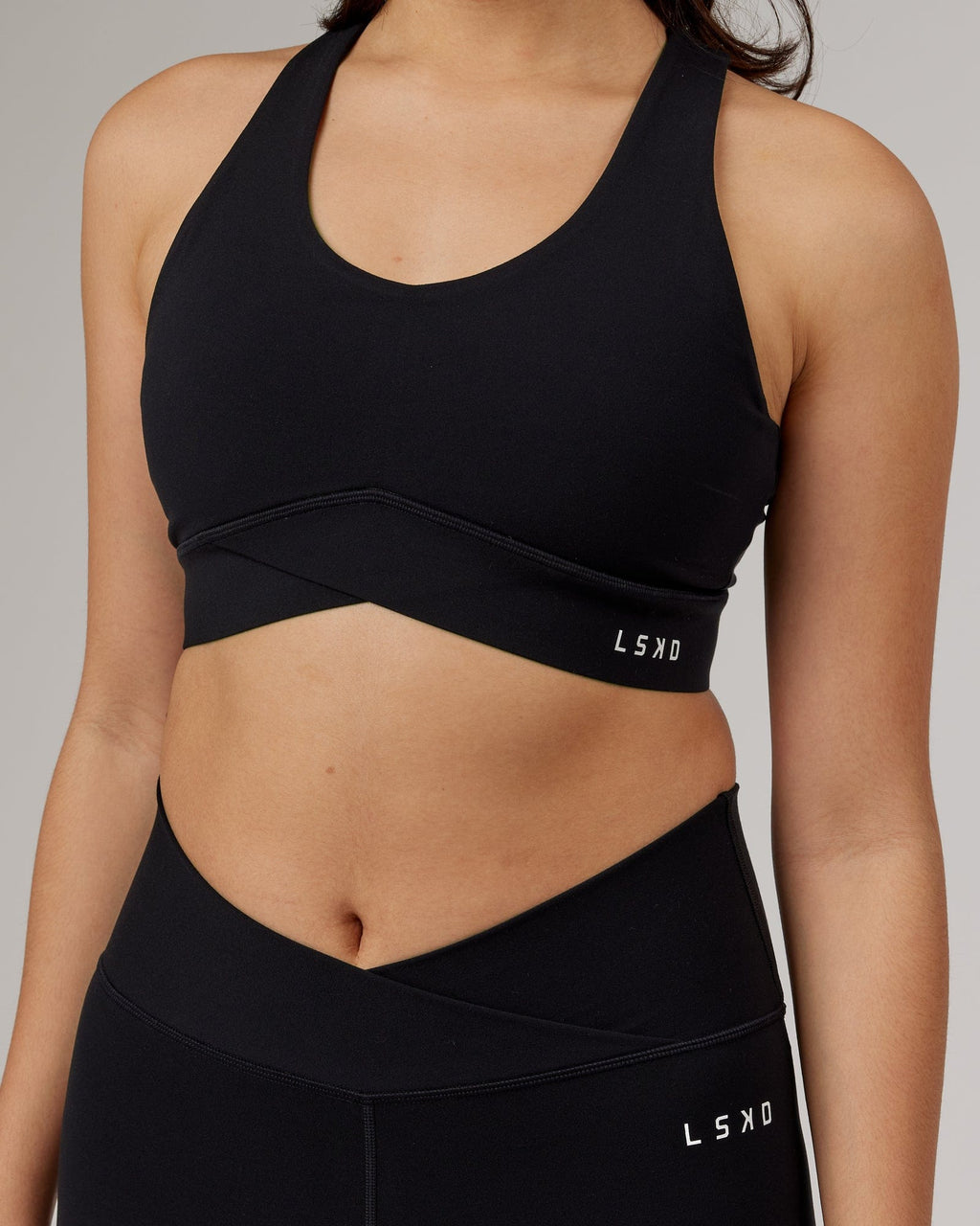 Model wearing Strike Sports Bra - Black