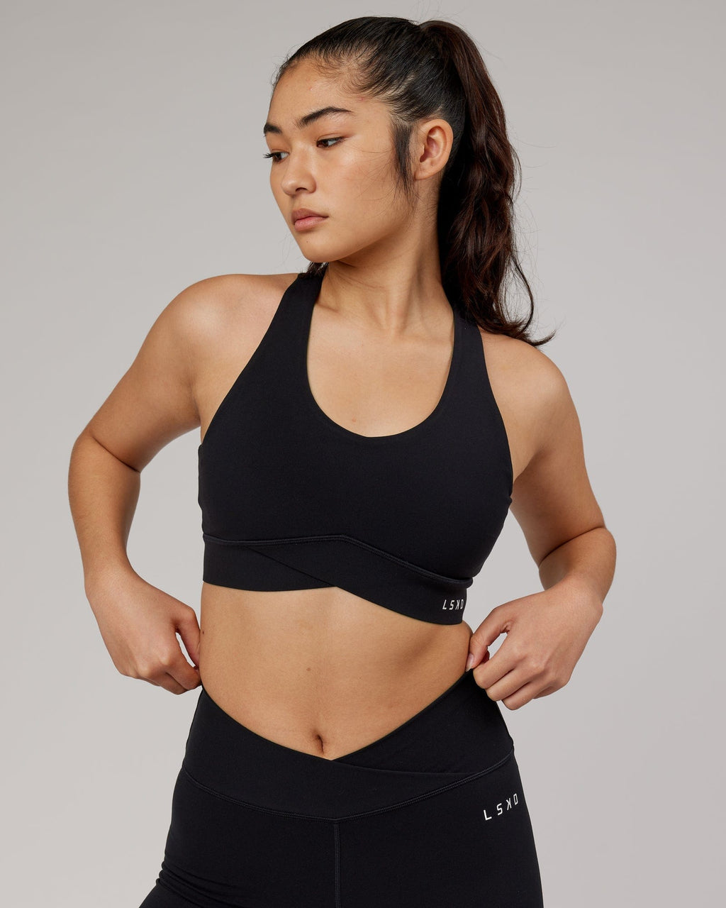 Model wearing Strike Sports Bra - Black