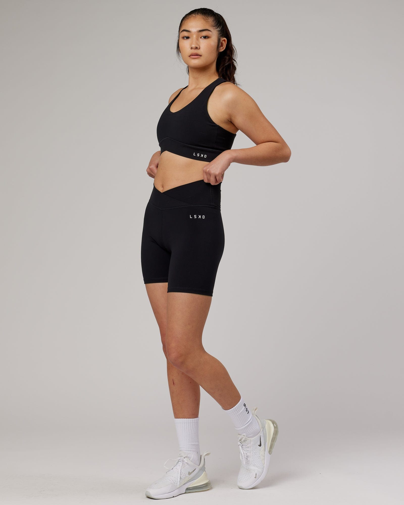 Model wearing Strike Sports Bra - Black