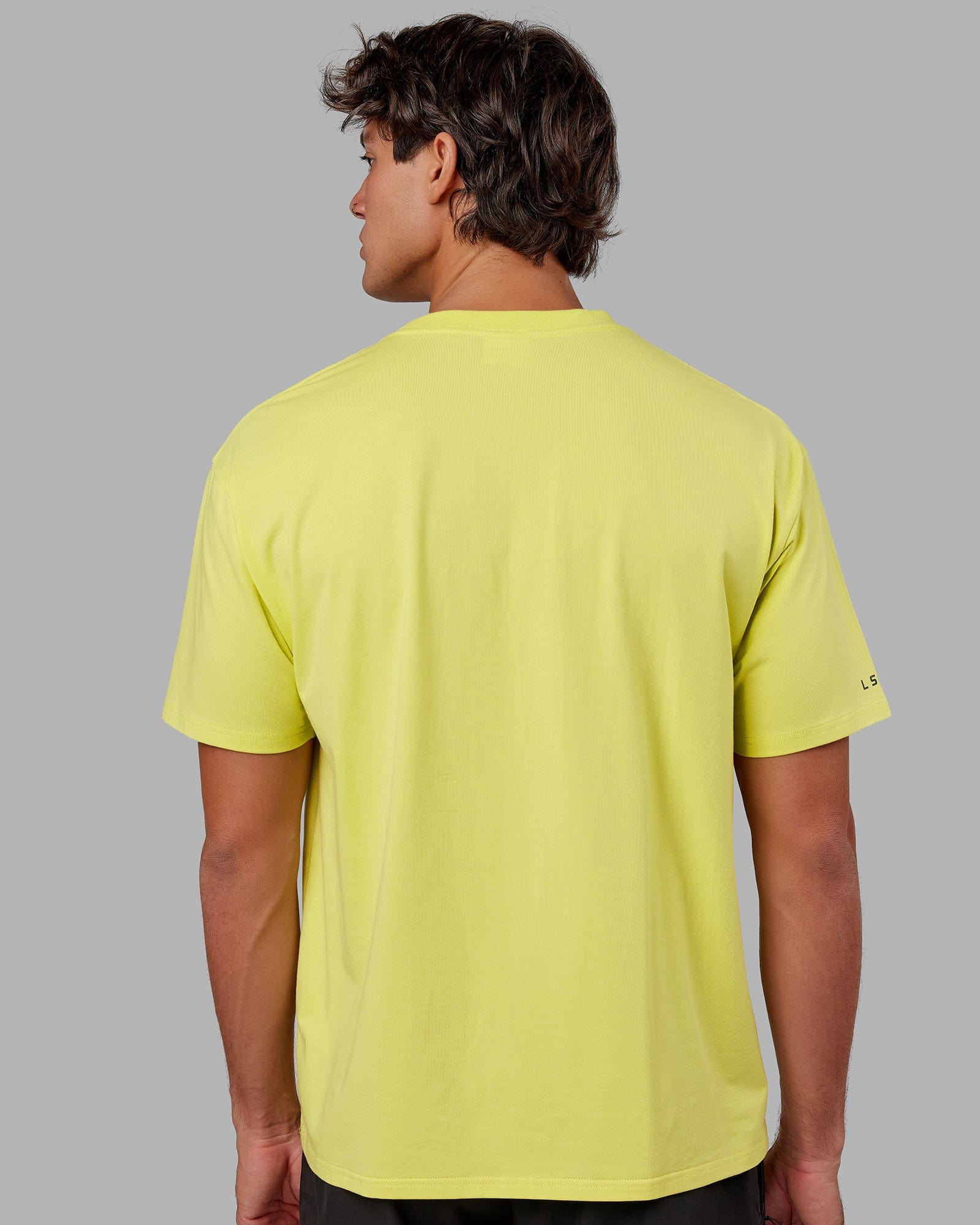 Model wearing Strive FLXCotton Tee Oversize - Citrus Green
