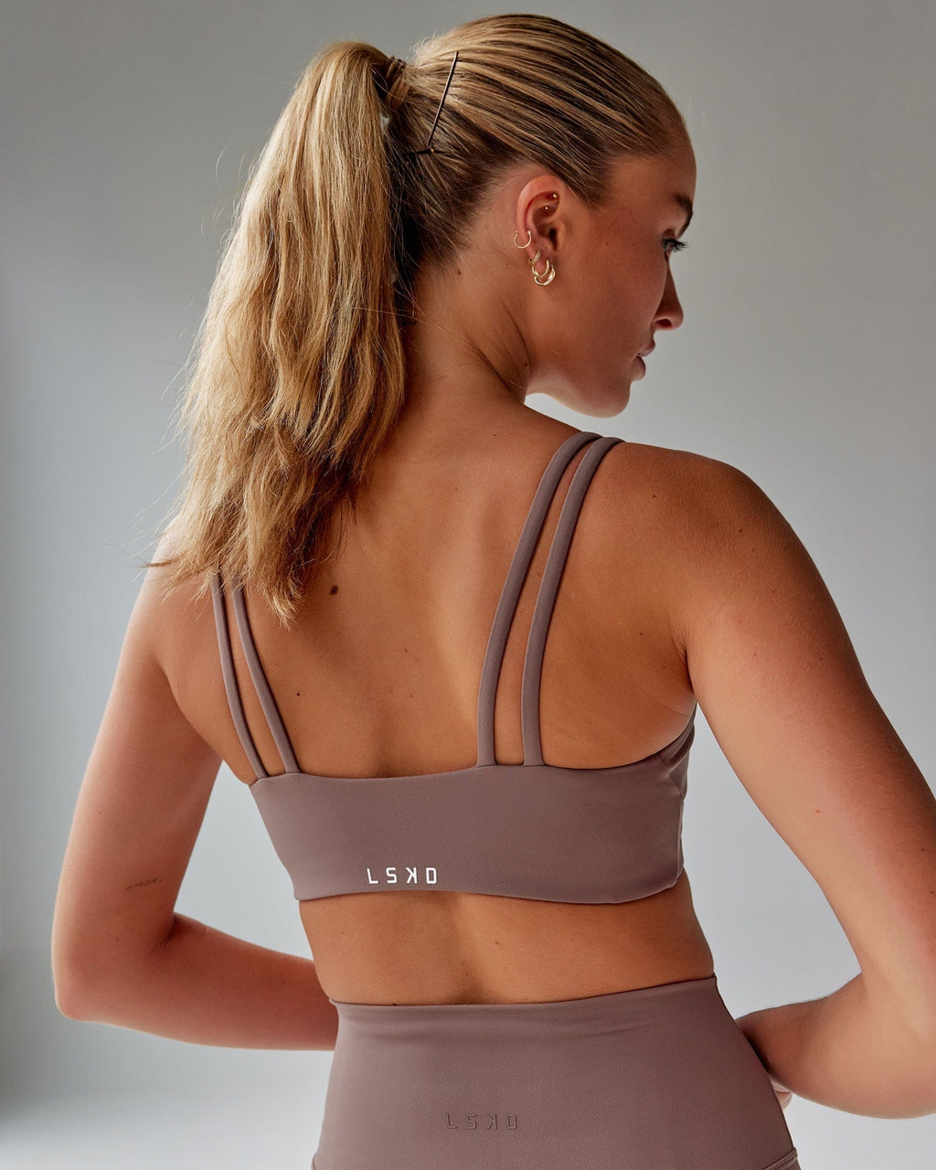 Model wearing Structure Sports Bra - Deep Taupe