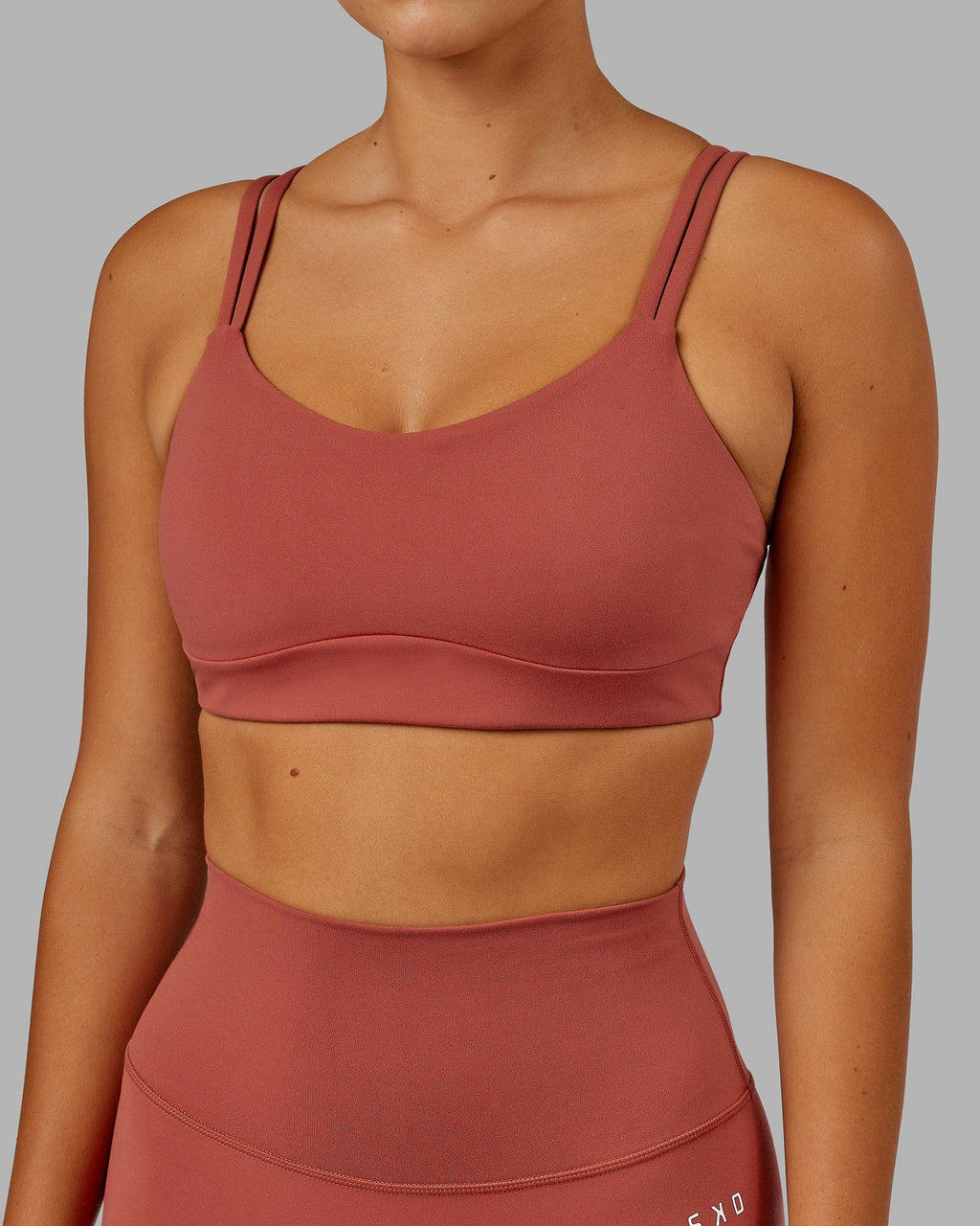 Model wearing Structure Sports Bra - Paprika