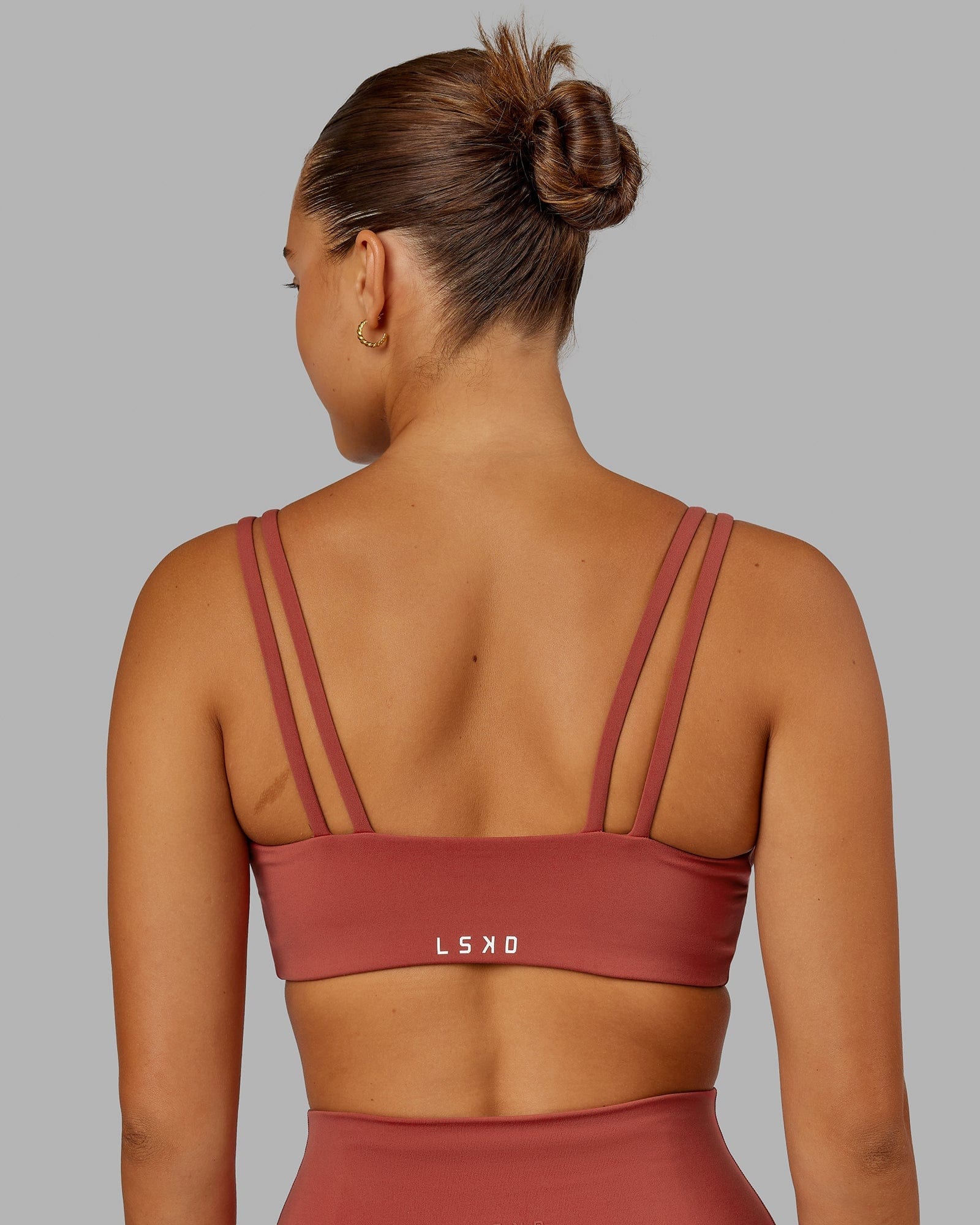 Model wearing Structure Sports Bra - Paprika