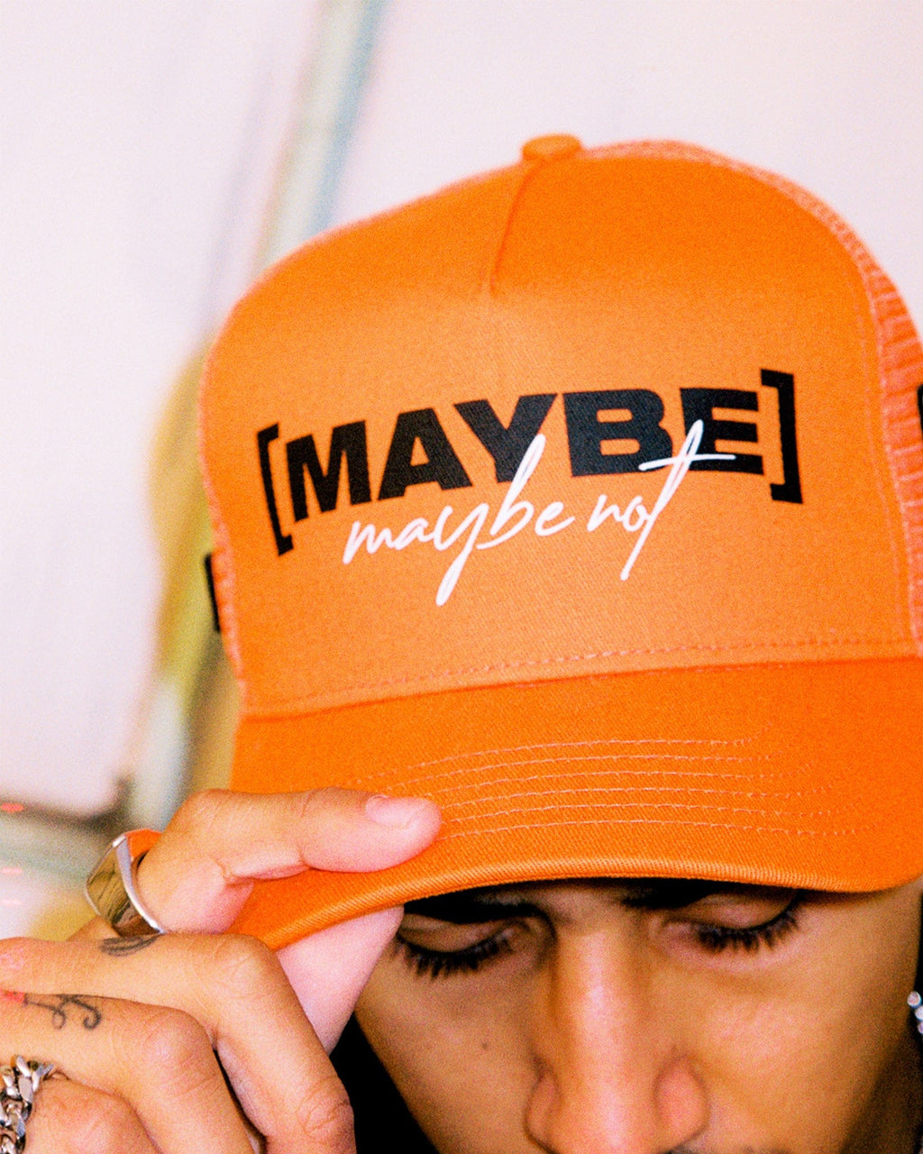 Model wearing TOBK Trucker Hat - Orange