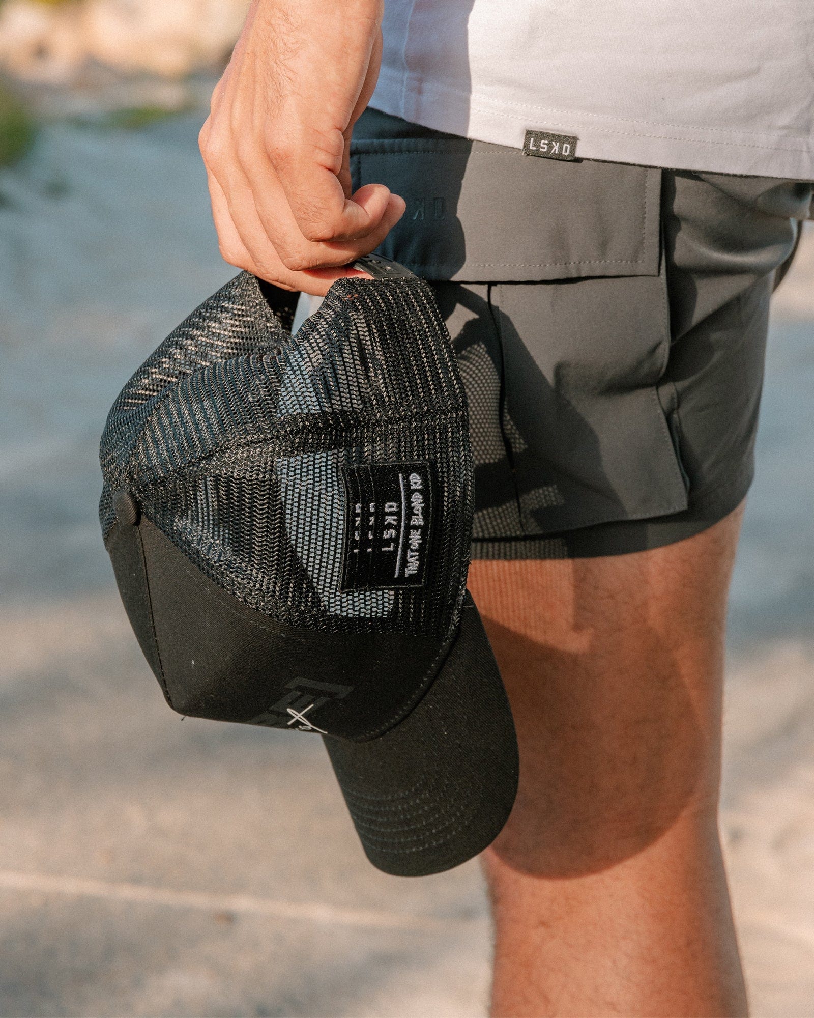 Model wearing TOBK Trucker Hat - Black