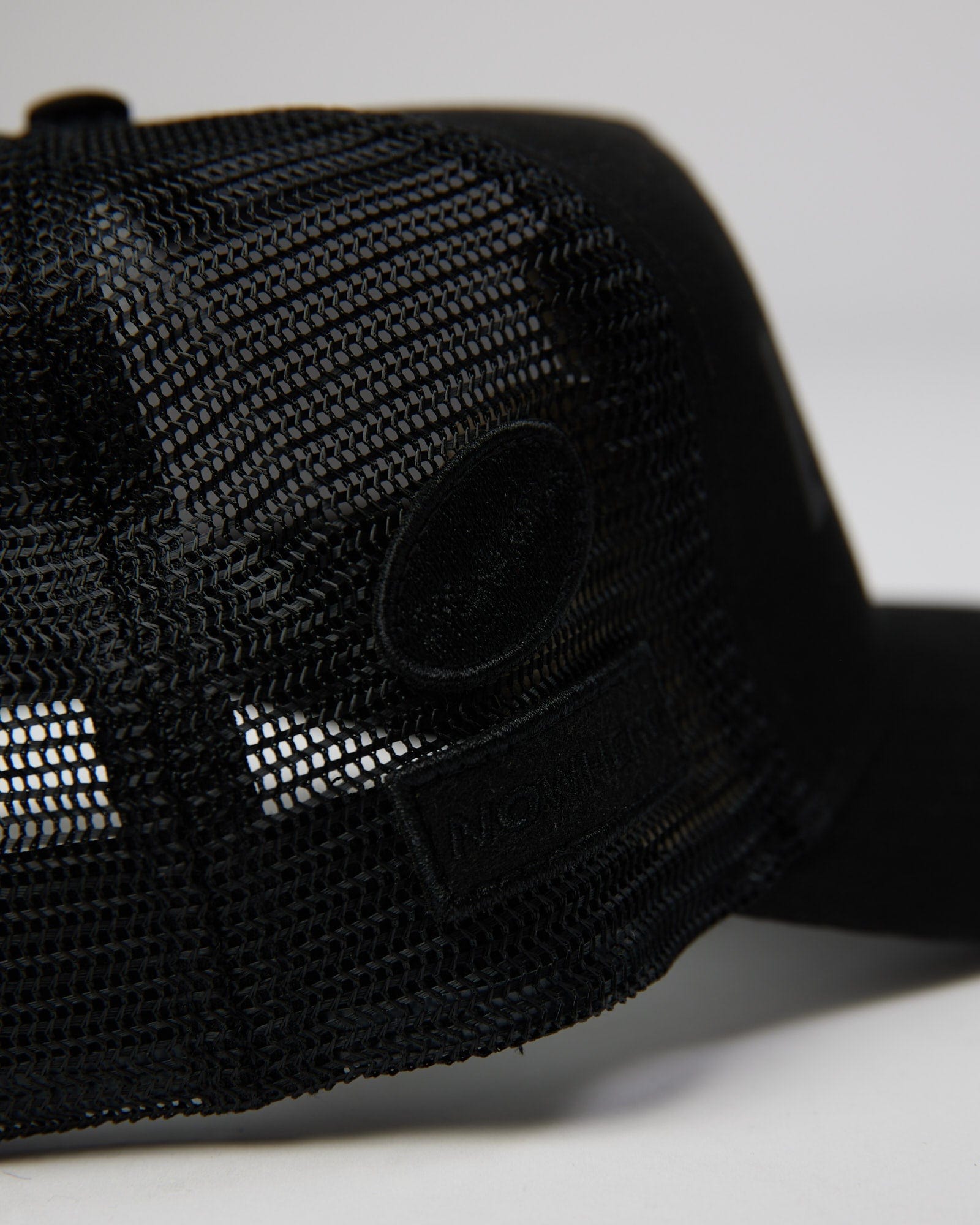 Model wearing TOBK Trucker Hat - Black