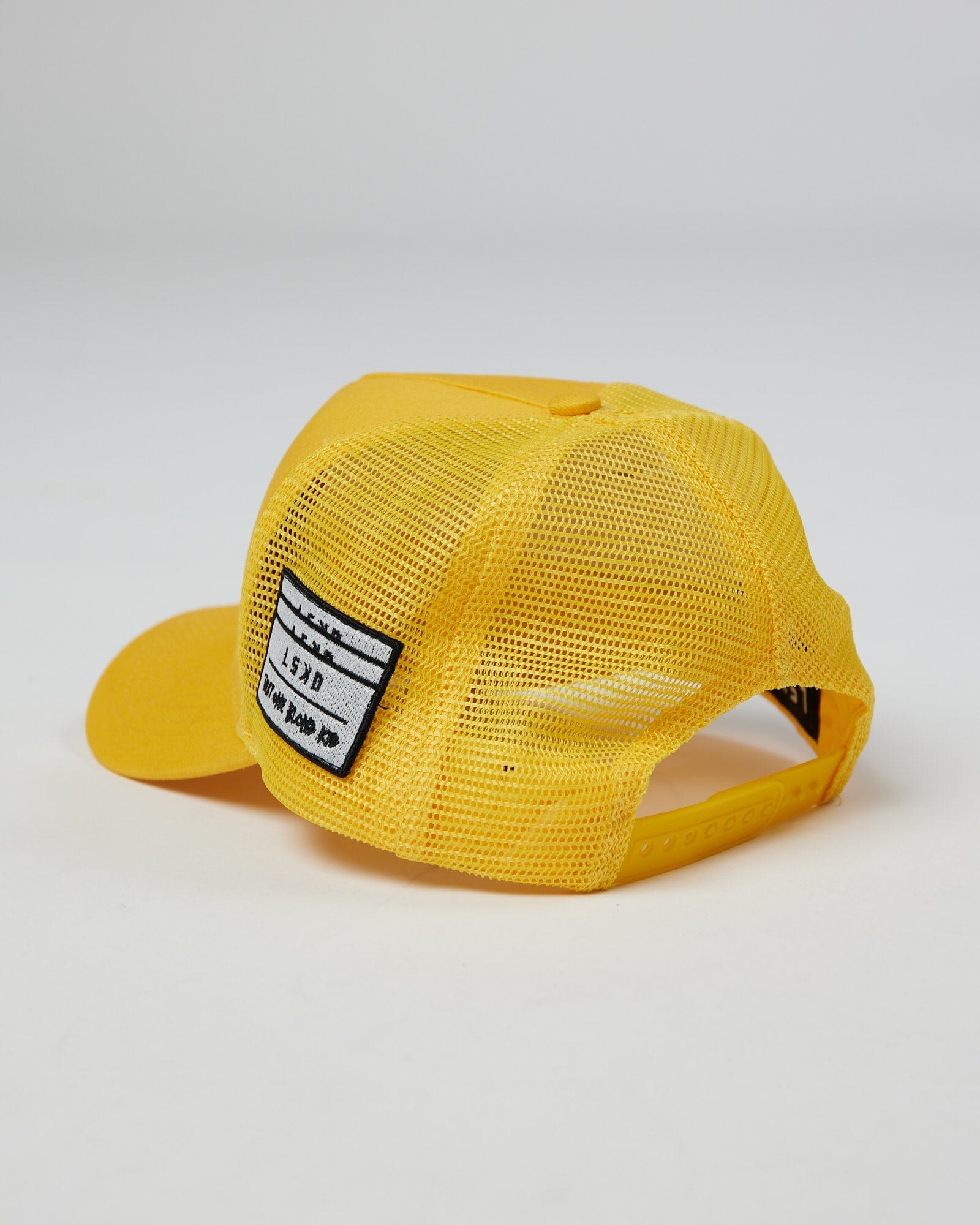 Model wearing TOBK Trucker Hat - Yellow