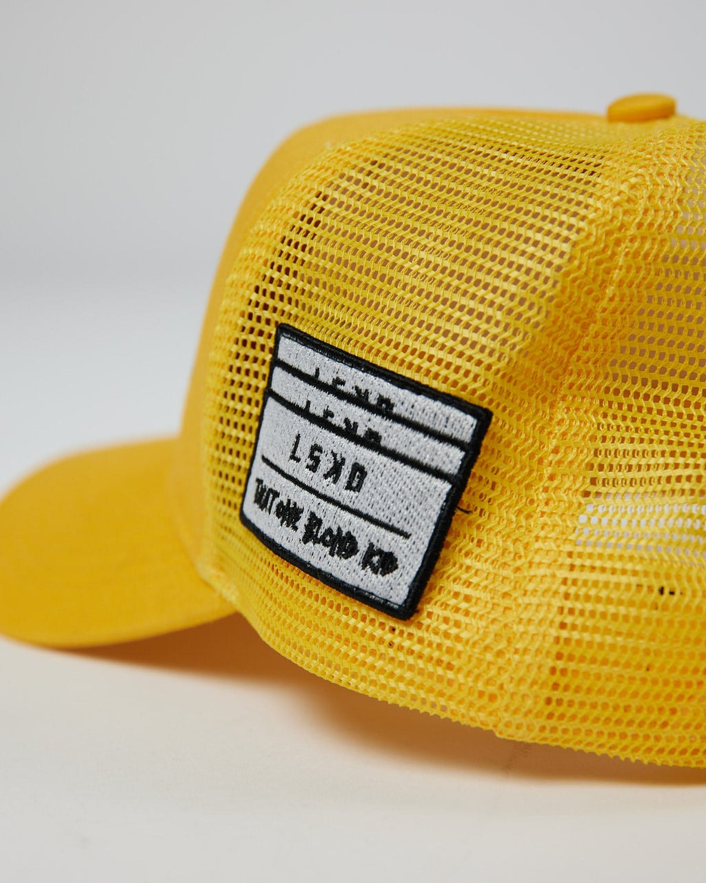 Model wearing TOBK Trucker Hat - Yellow