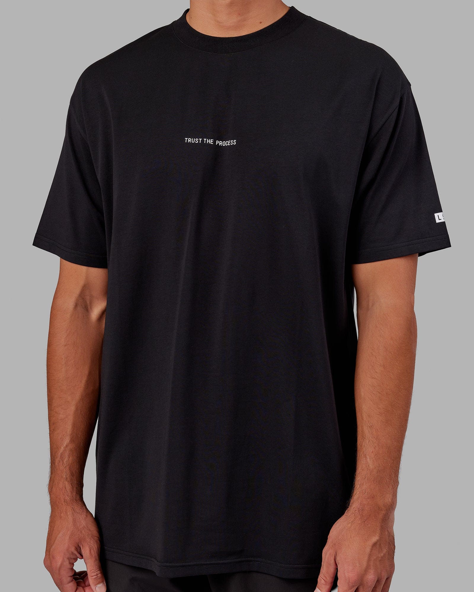 Model wearing Trust The Process FLXCotton Tee Longline Oversize - Black