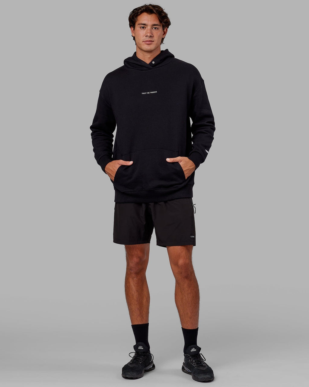 Model wearing Trust The Process Hoodie Oversize - Black