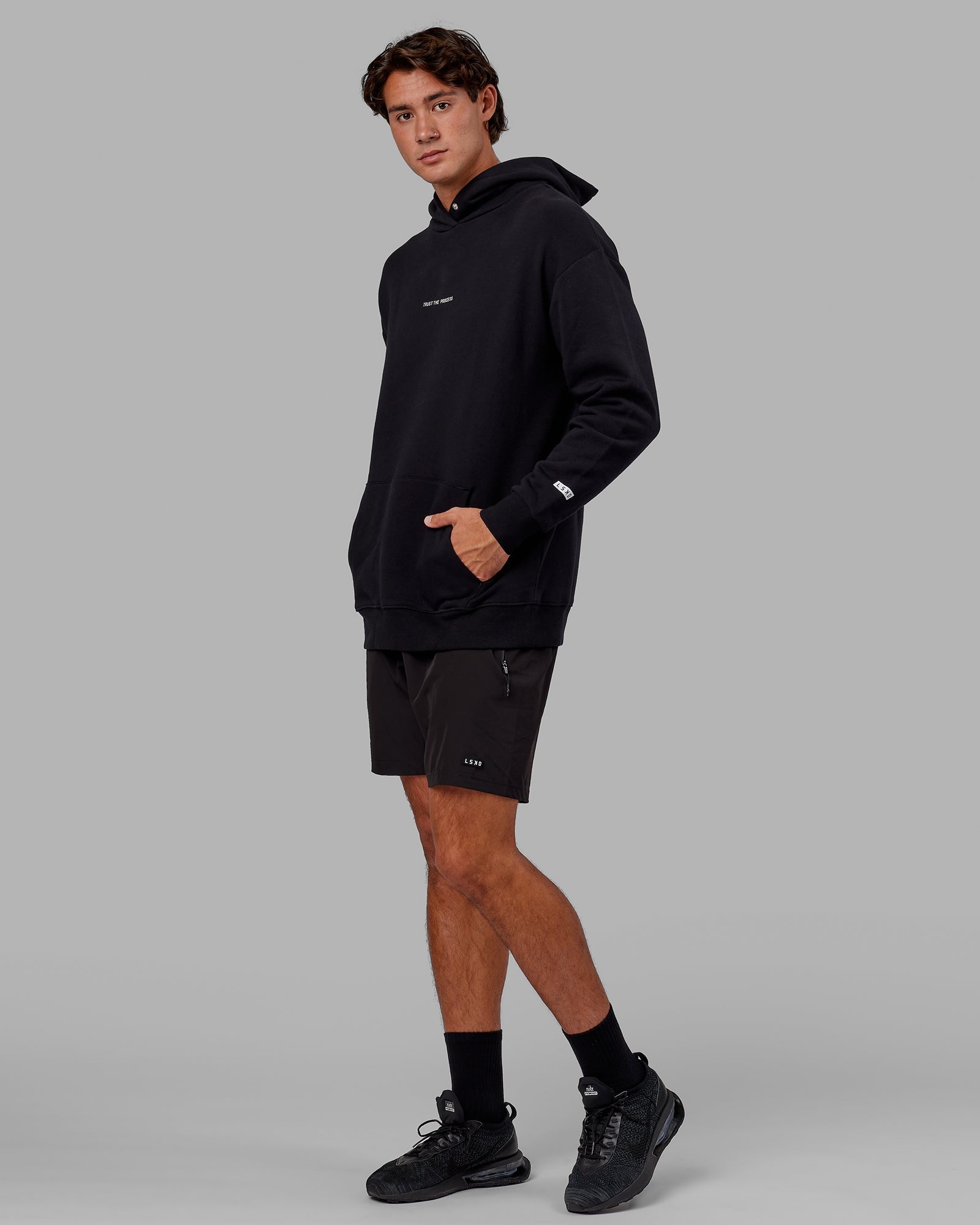 Model wearing Trust The Process Hoodie Oversize - Black