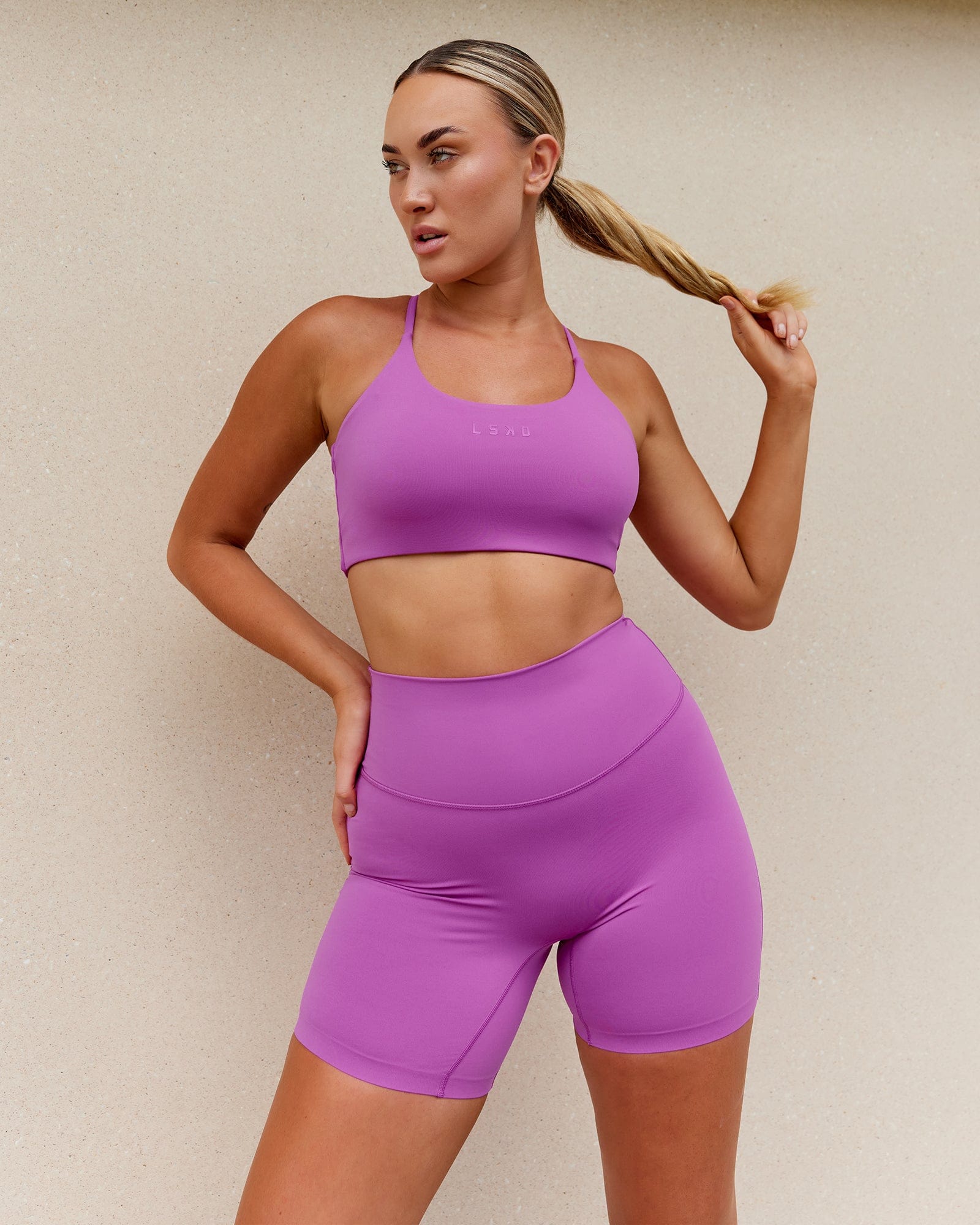 Model wearing Twist Sports Bra - Orchid