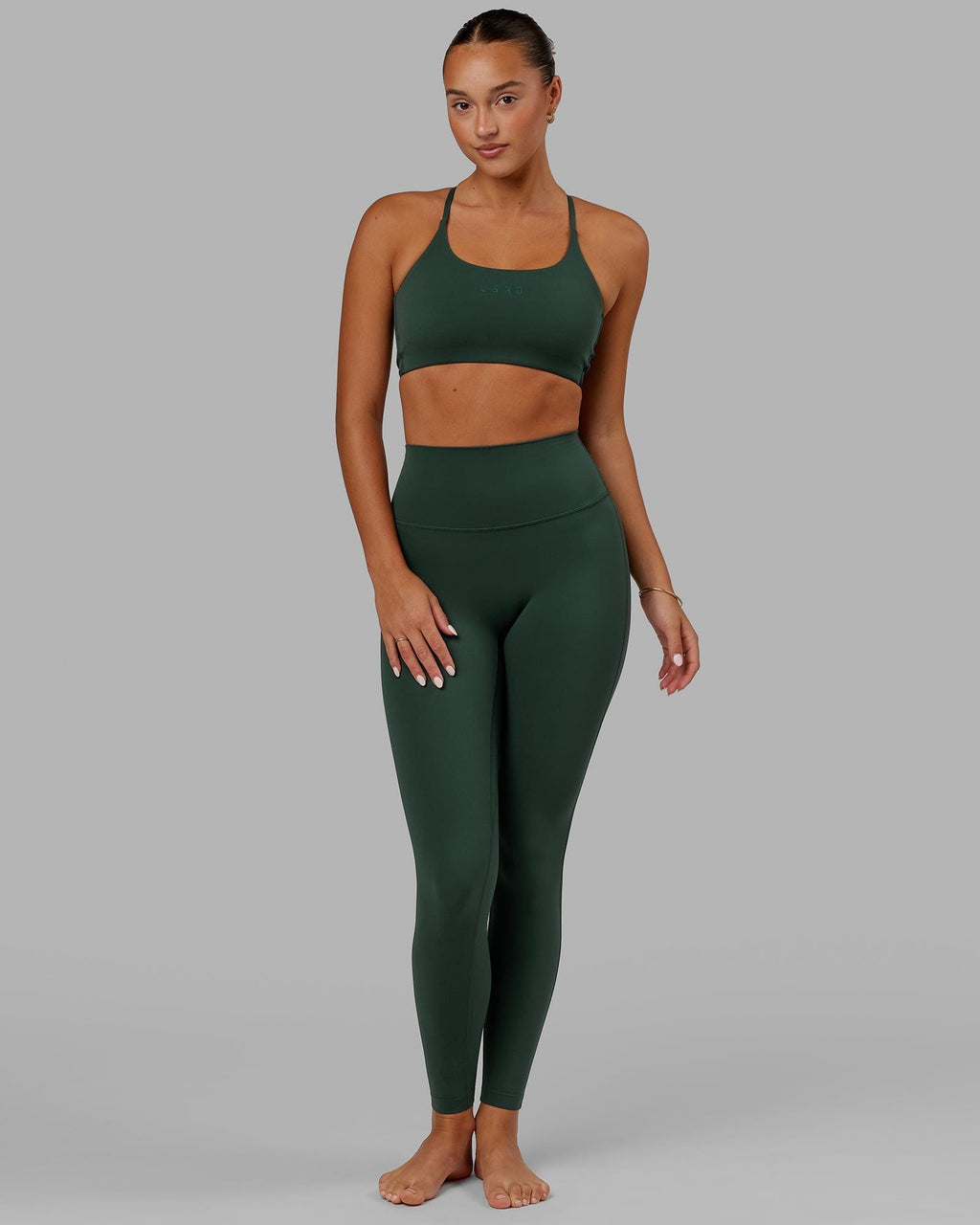 Model wearing Twist Sports Bra - Vital Green