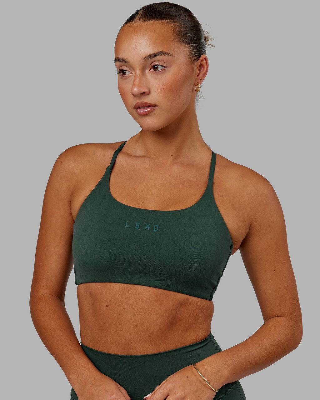 Model wearing Twist Sports Bra - Vital Green