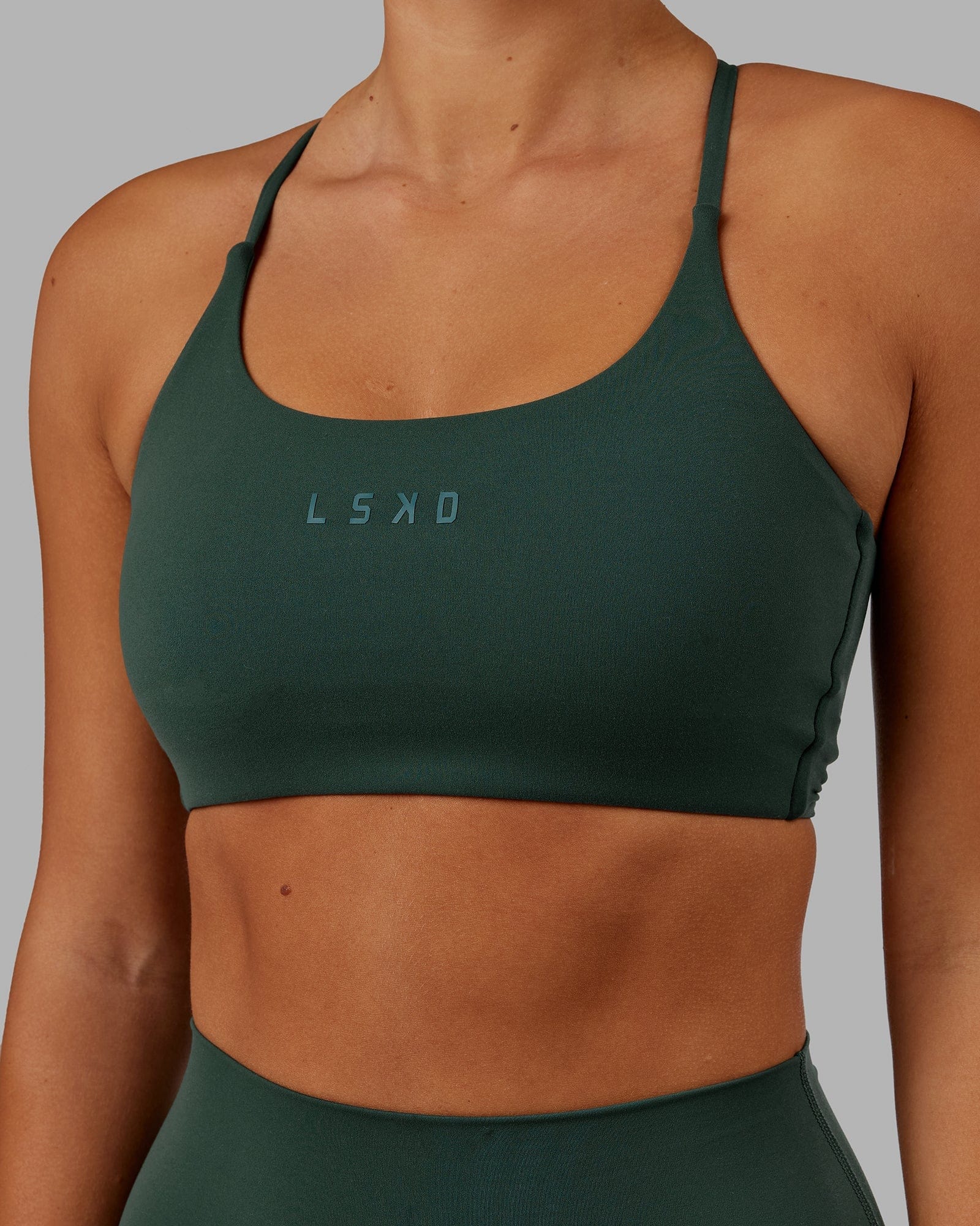 Model wearing Twist Sports Bra - Vital Green