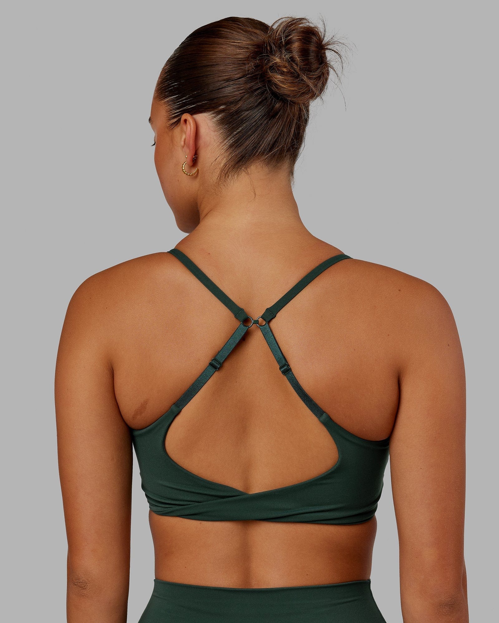 Model wearing Twist Sports Bra - Vital Green
