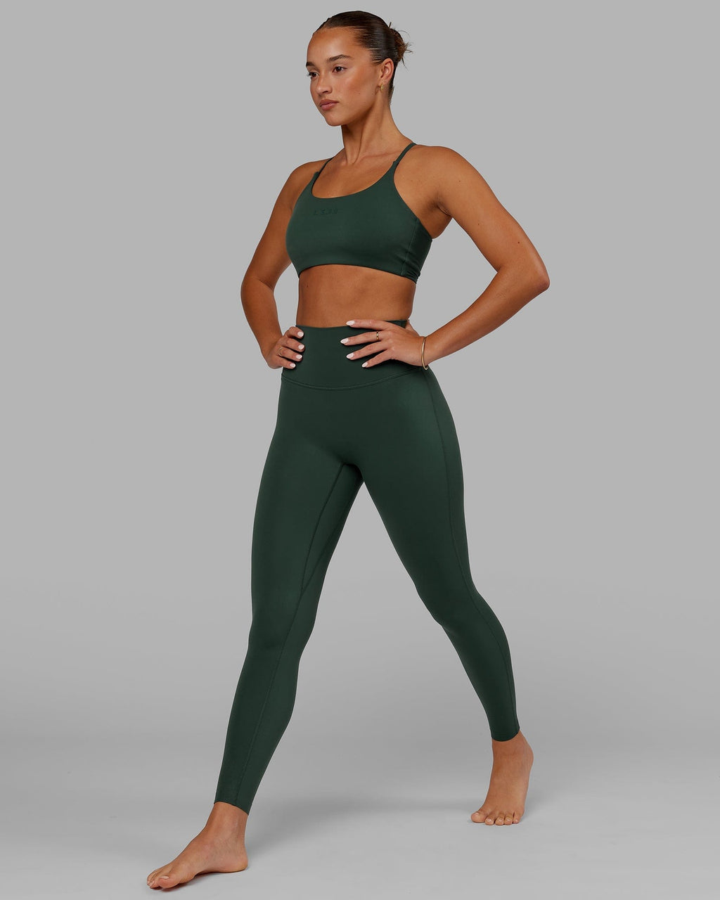 Model wearing Twist Sports Bra - Vital Green