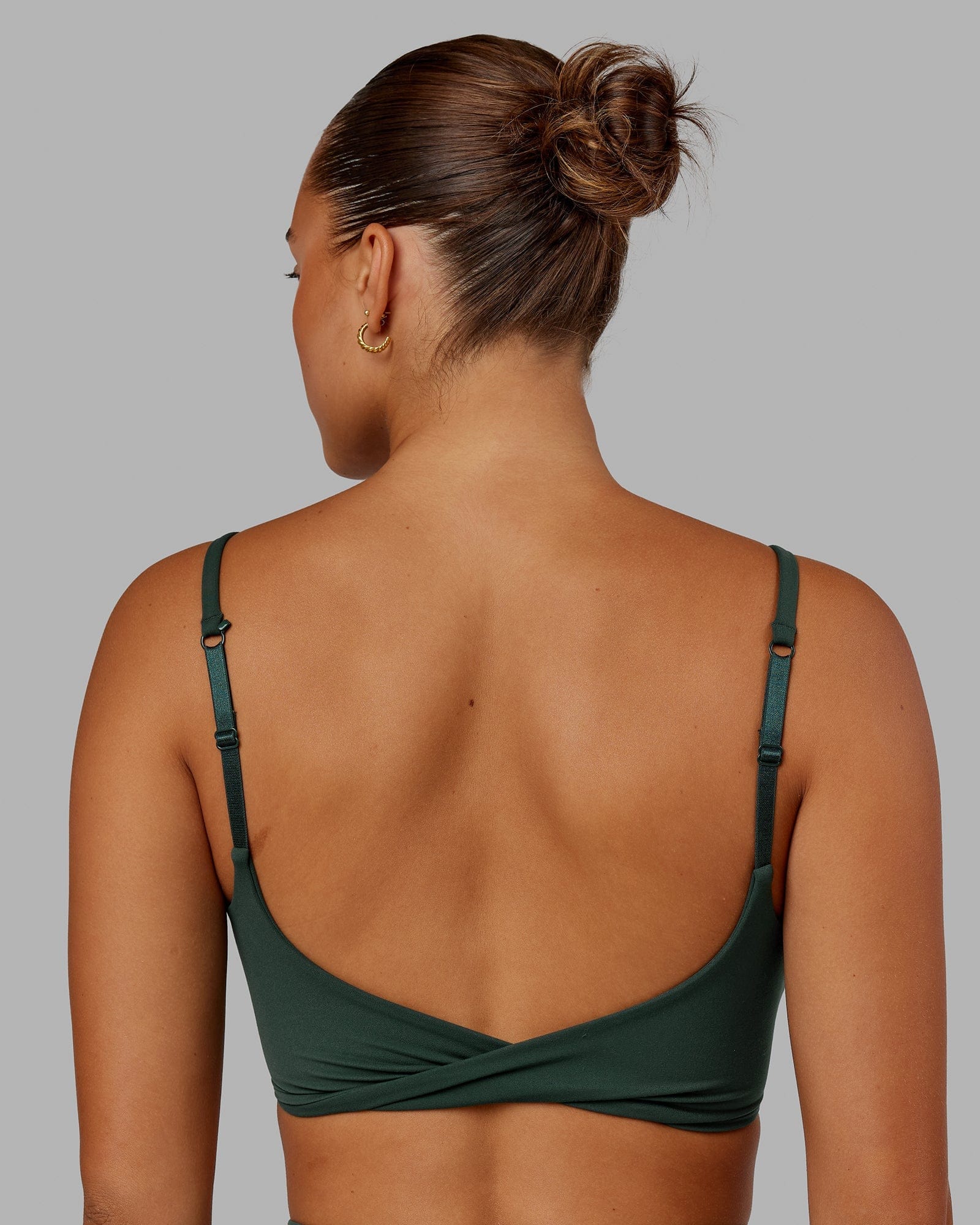 Model wearing Twist Sports Bra - Vital Green