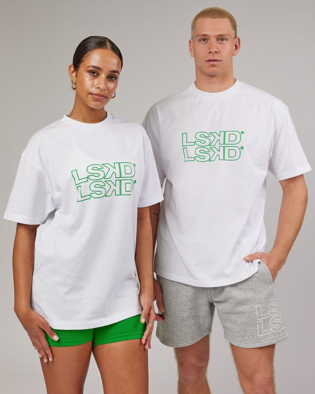 Model wearing Unisex Stacks Up Heavyweight Oversize Tee - White-Vivid Green