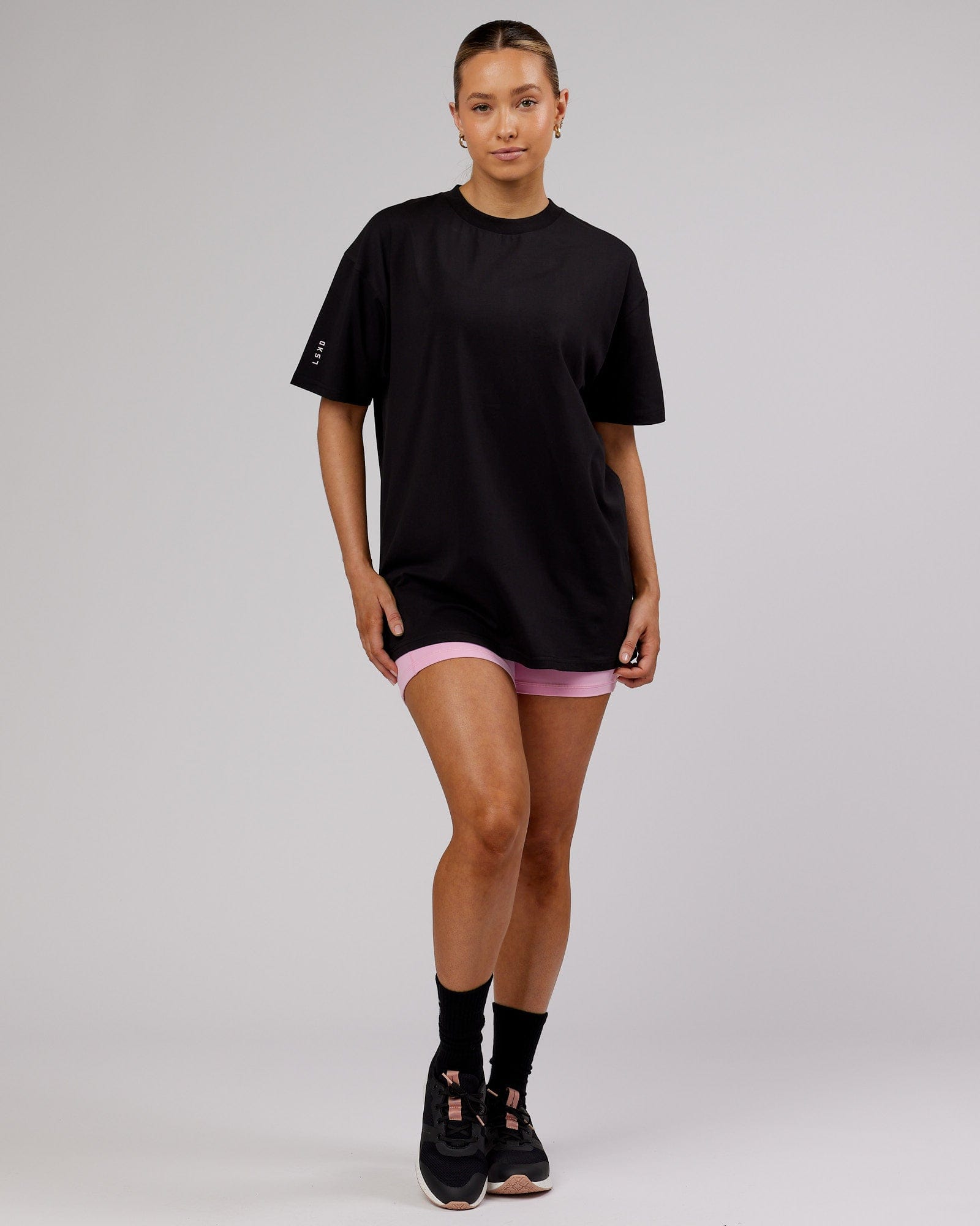 Model wearing Unisex LTRD FLXCotton Tee Oversize - Black-Pink