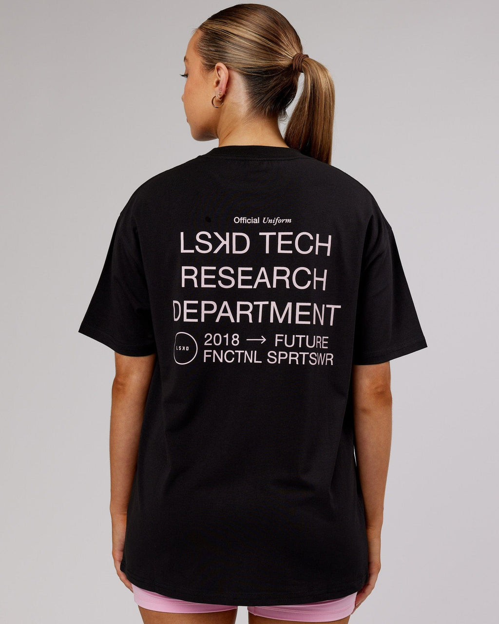 Model wearing Unisex LTRD FLXCotton Tee Oversize - Black-Pink