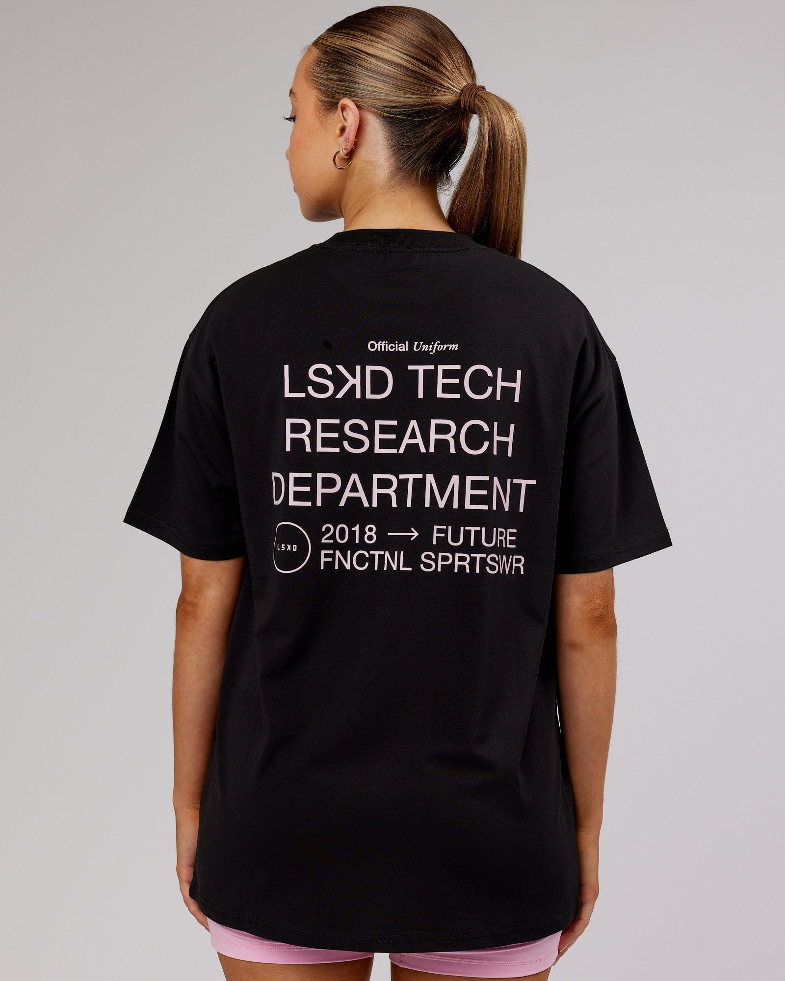 Model wearing Unisex LTRD FLXCotton Tee Oversize - Black-Pink