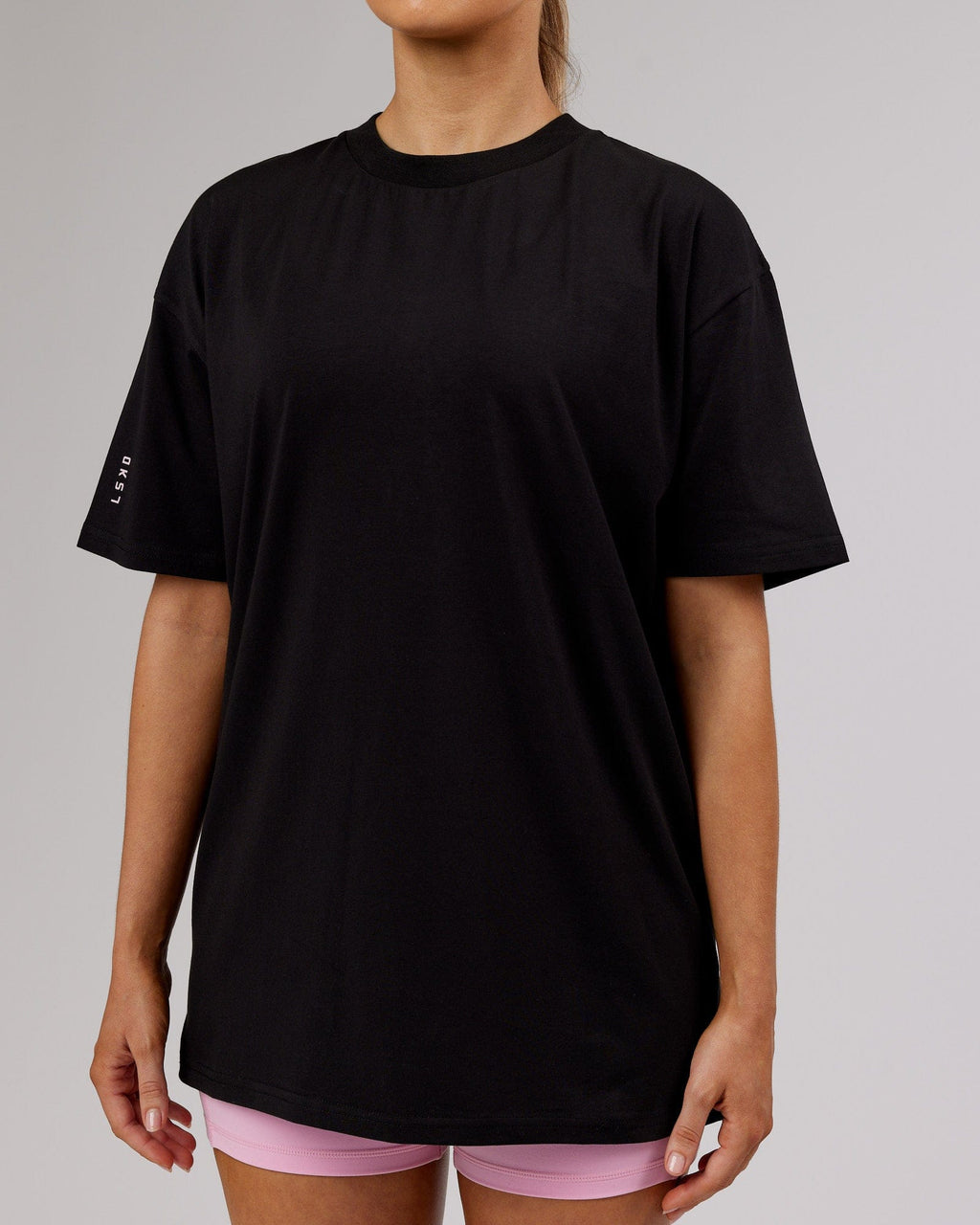 Model wearing Unisex LTRD FLXCotton Tee Oversize - Black-Pink