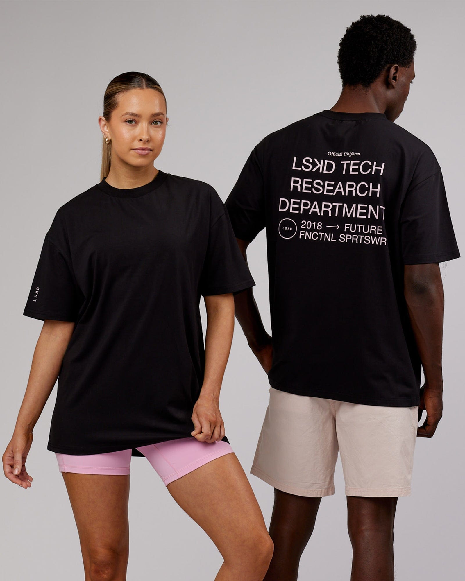 Model wearing Unisex LTRD FLXCotton Tee Oversize - Black-Pink
