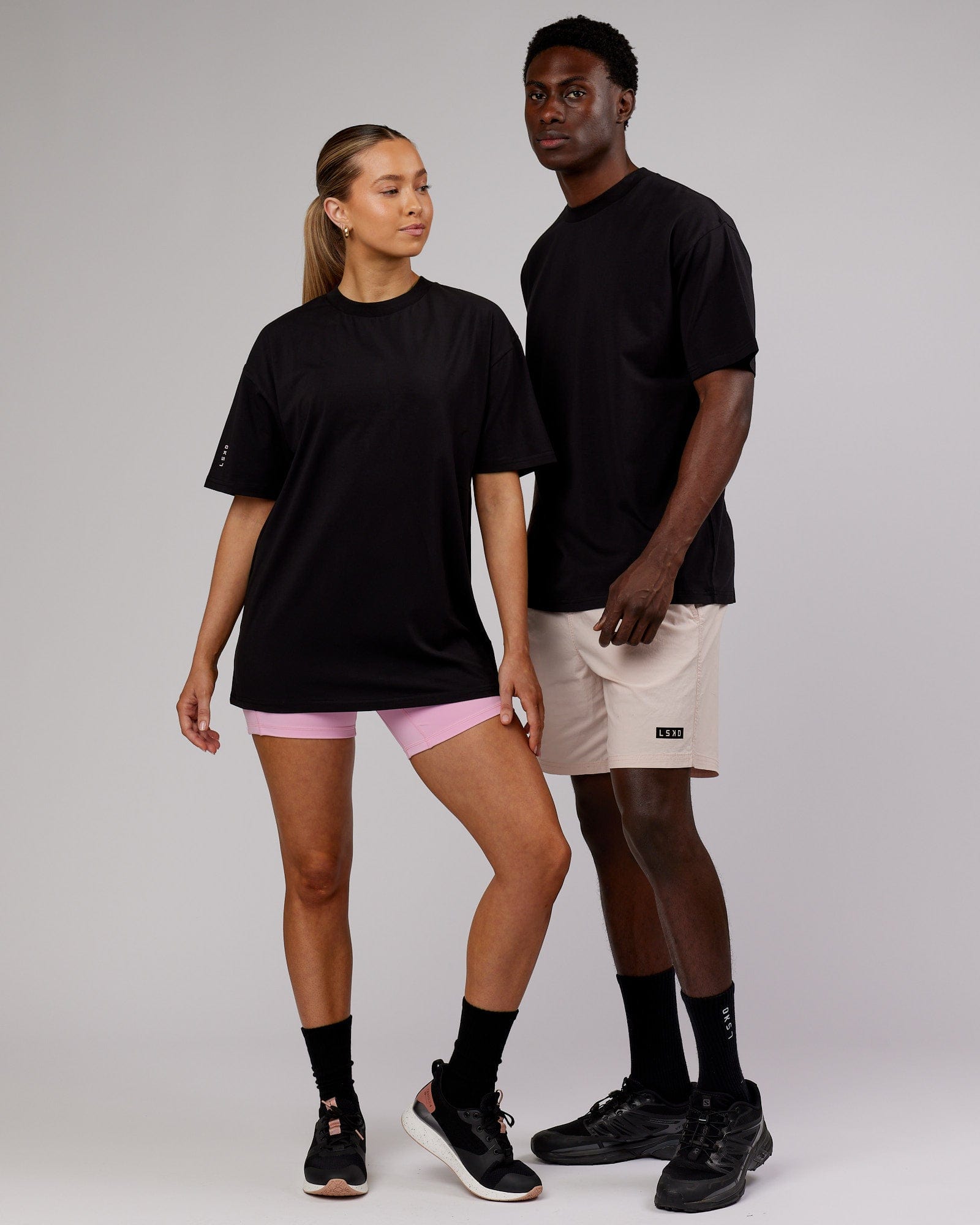Model wearing Unisex LTRD FLXCotton Tee Oversize - Black-Pink