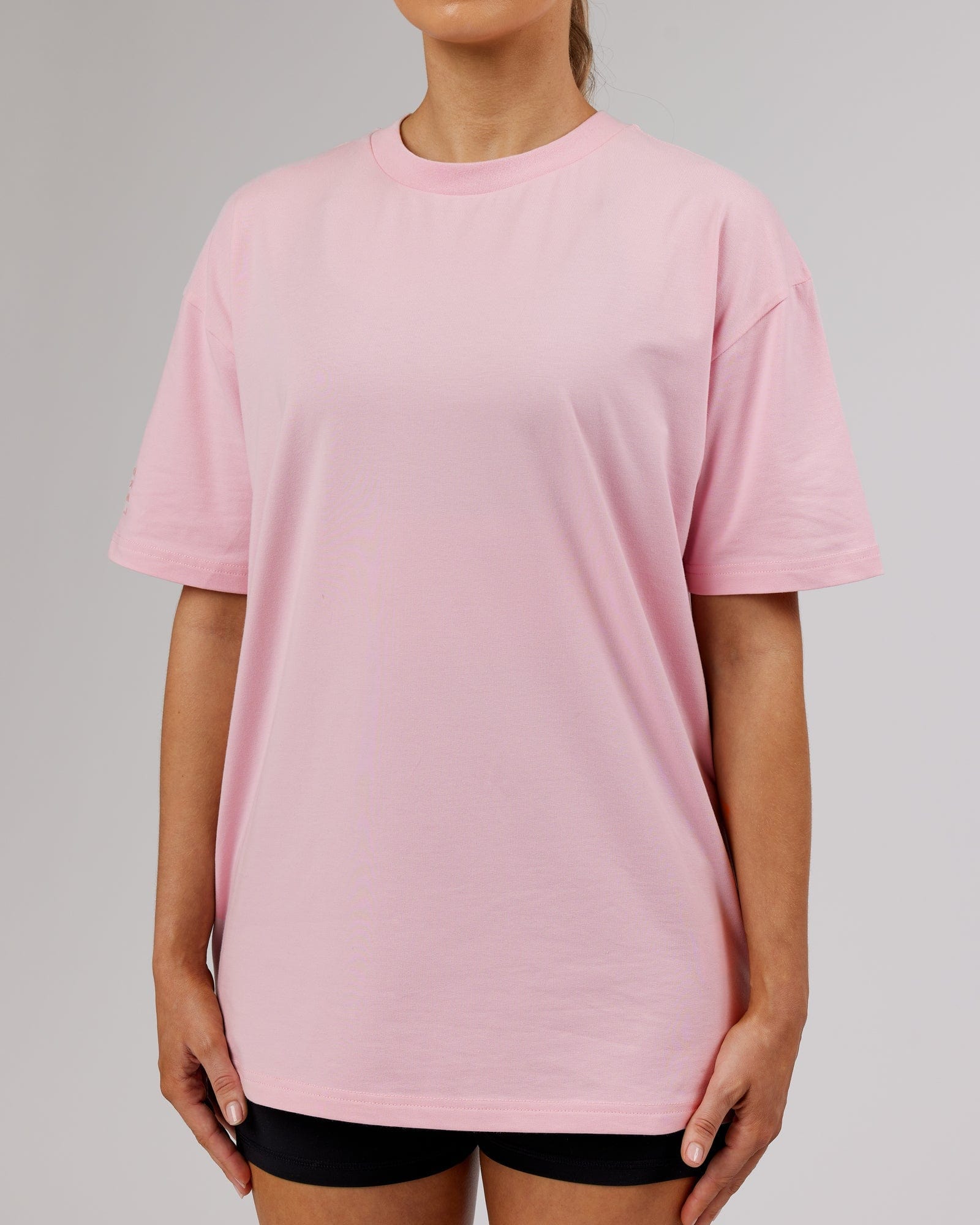 Model wearing Unisex LTRD FLXCotton Tee Oversize - Bleached Mauve