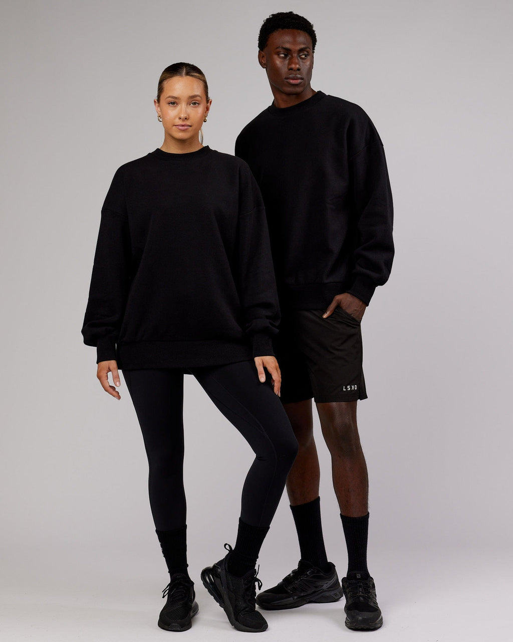 Model wearing Unisex LTRD Sweater Oversize - Black-Pink