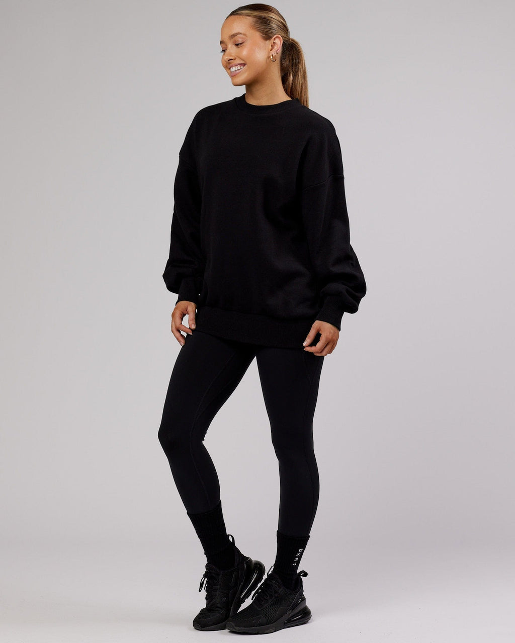 Model wearing Unisex LTRD Sweater Oversize - Black-Pink