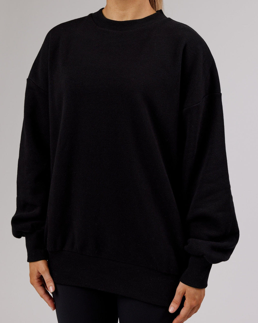 Model wearing Unisex LTRD Sweater Oversize - Black-Pink