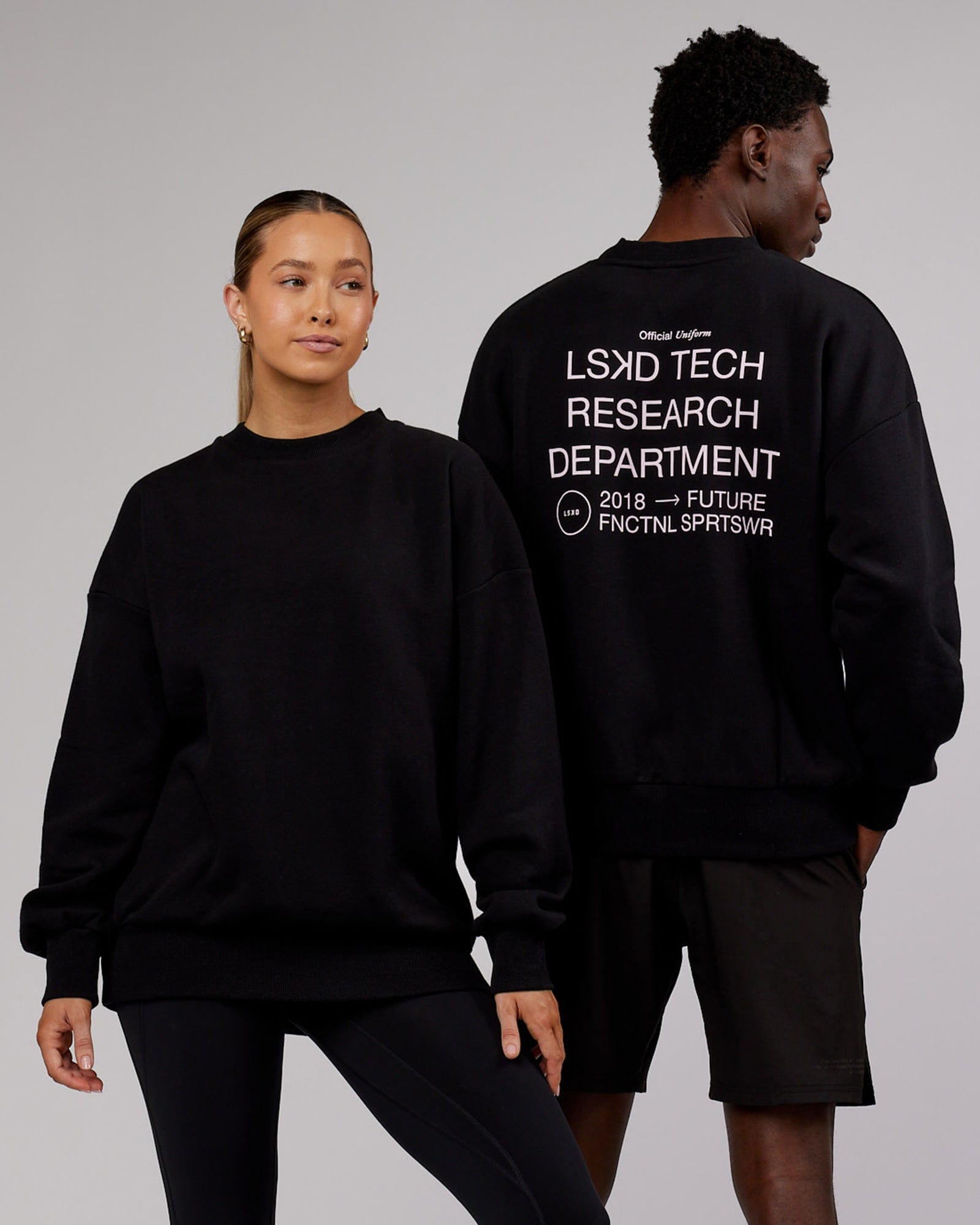 Model wearing Unisex LTRD Sweater Oversize - Black-Pink