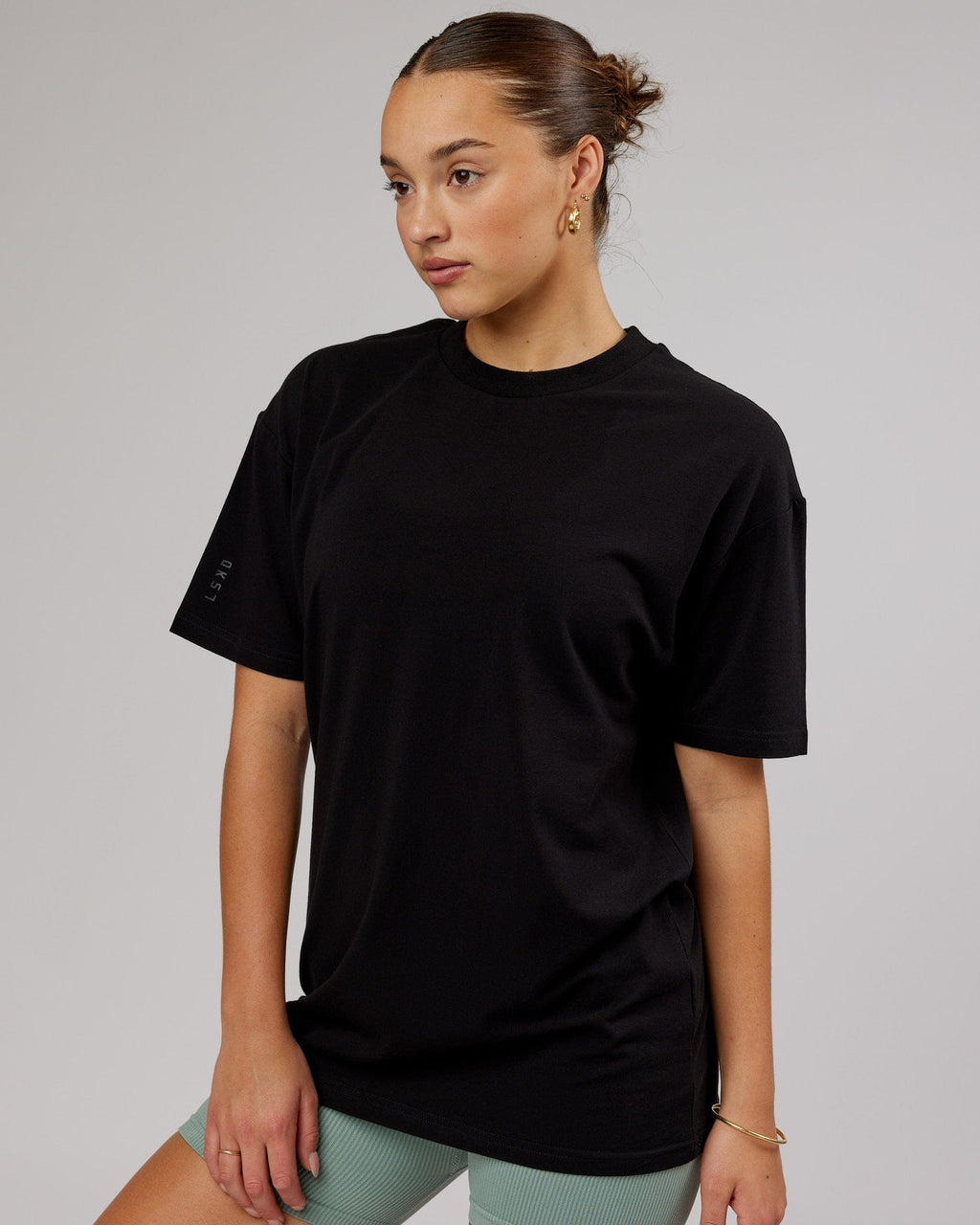 Model wearing Unisex LTRD FLXCotton Tee Oversize - Black-Black