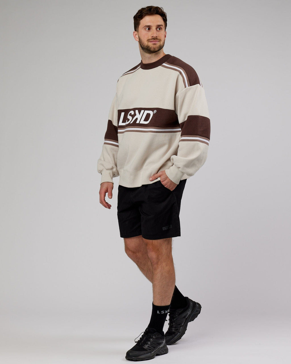 Model wearing Unisex A-Team Sweater Oversize - White-Deep Taupe