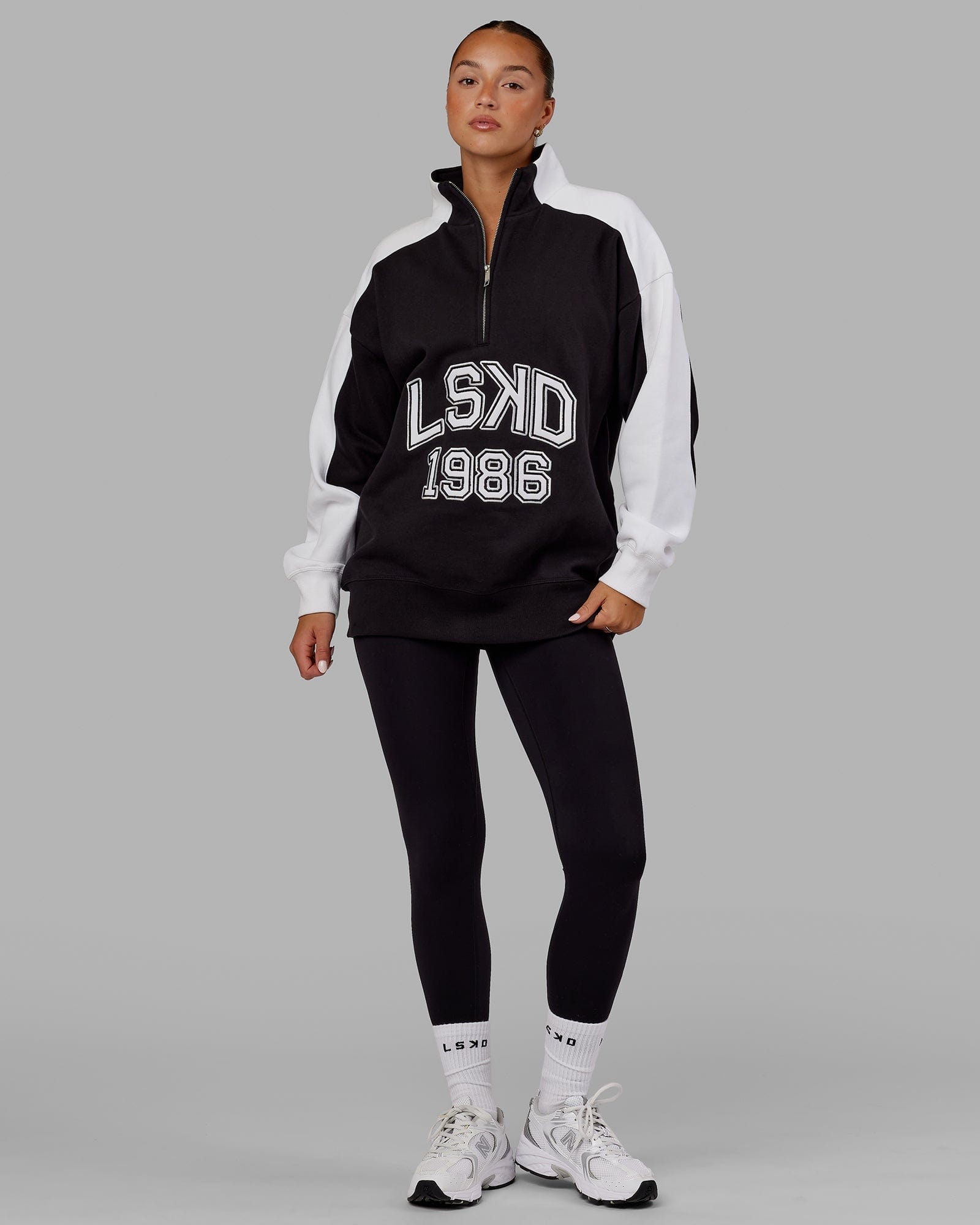 Model wearing Unisex Alumni 1/4 Zip Sweater Oversize - Black-White