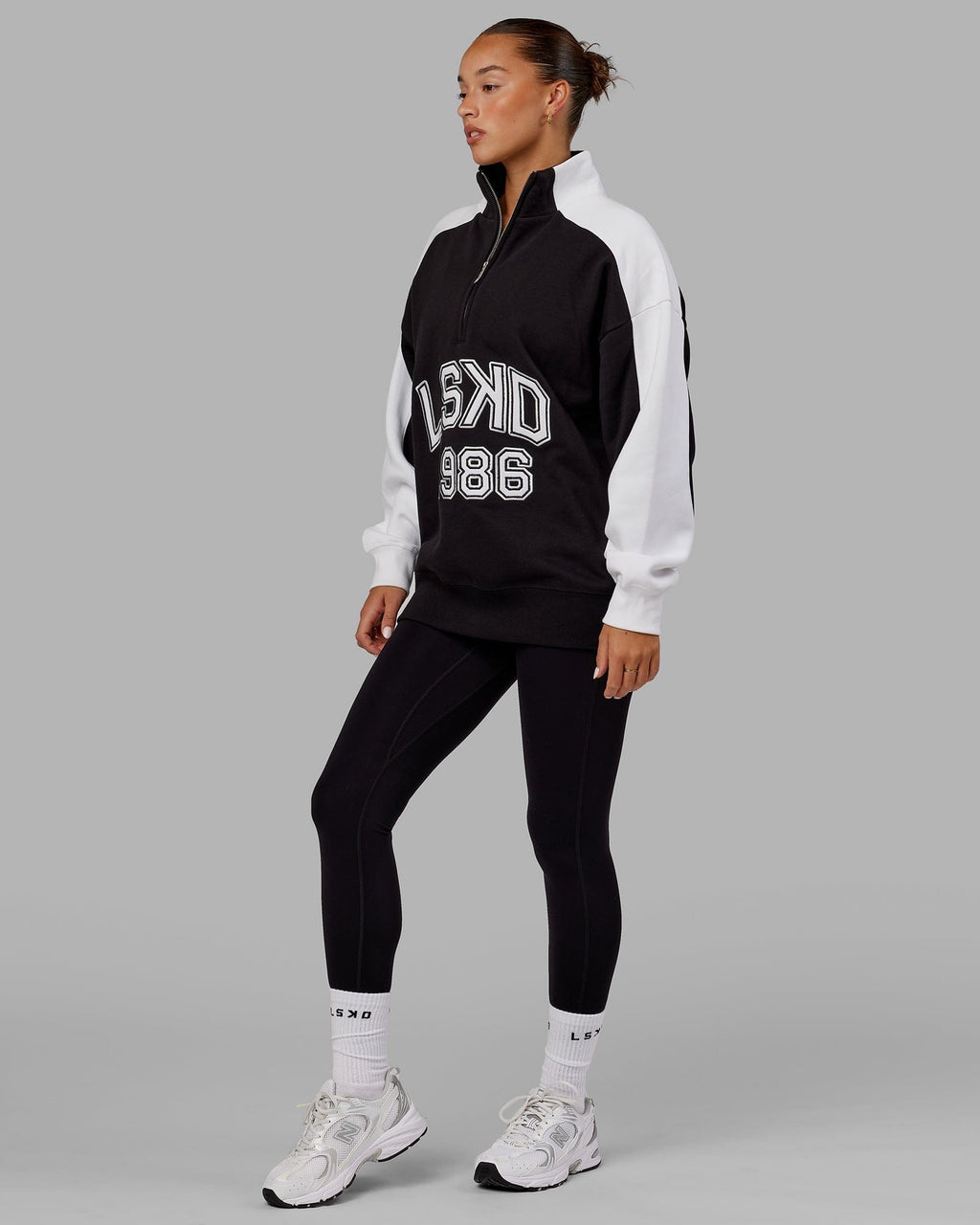 Model wearing Unisex Alumni 1/4 Zip Sweater Oversize - Black-White