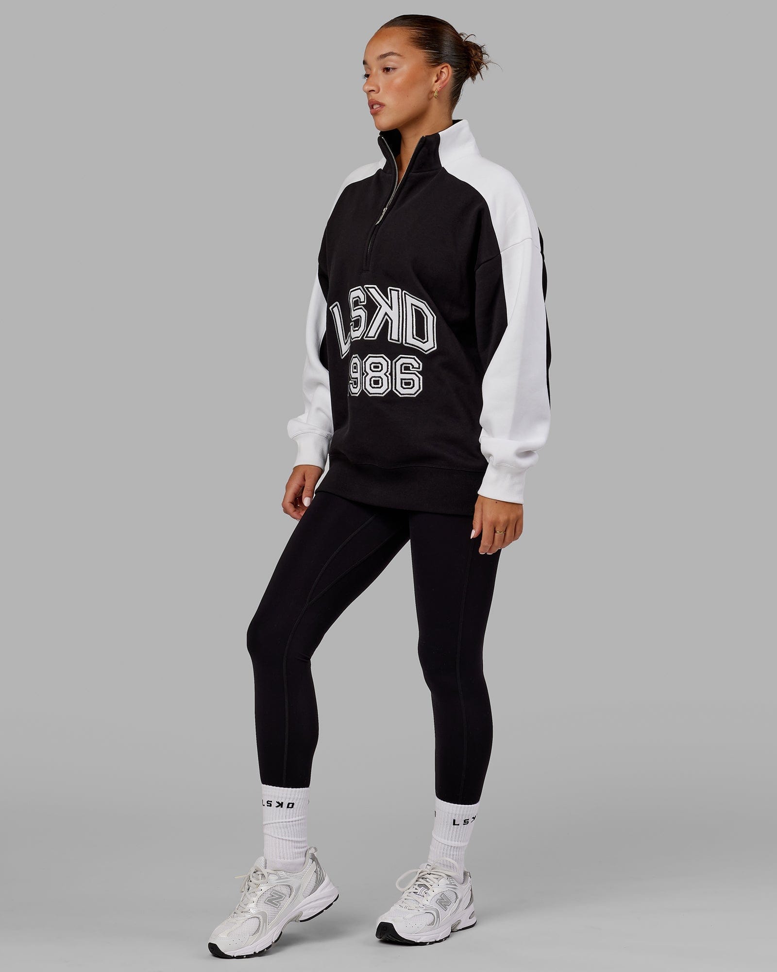 Model wearing Unisex Alumni 1/4 Zip Sweater Oversize - Black-White