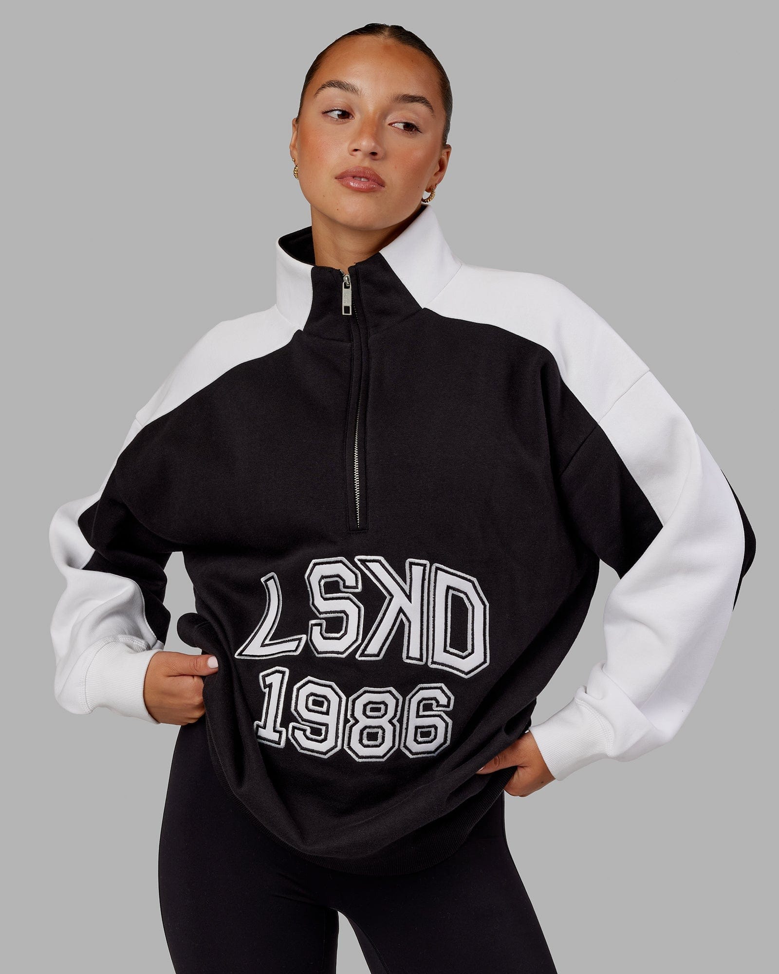 Model wearing Unisex Alumni 1/4 Zip Sweater Oversize - Black-White