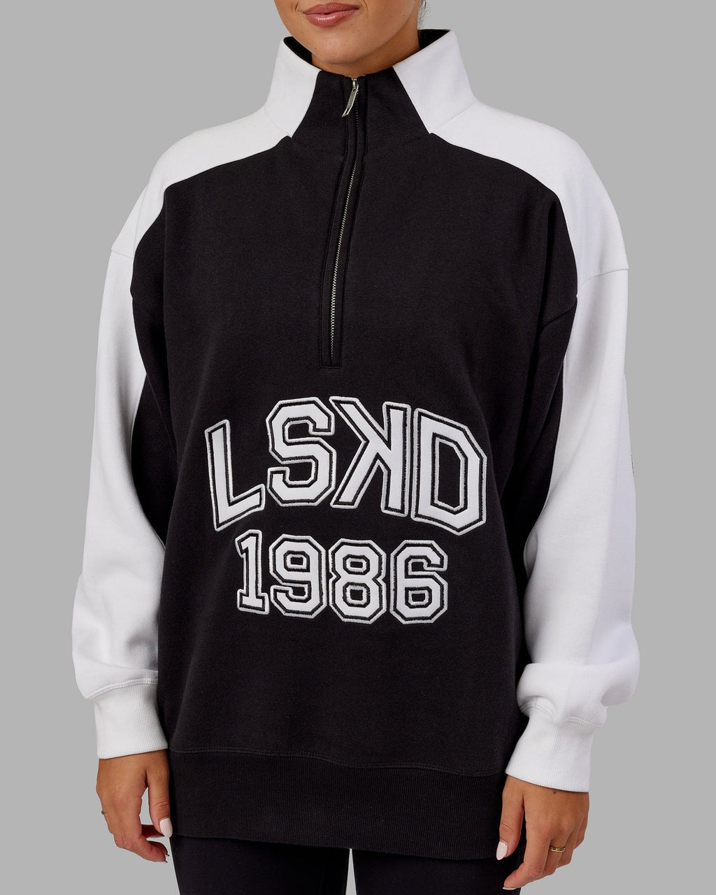 Model wearing Unisex Alumni 1/4 Zip Sweater Oversize - Black-White
