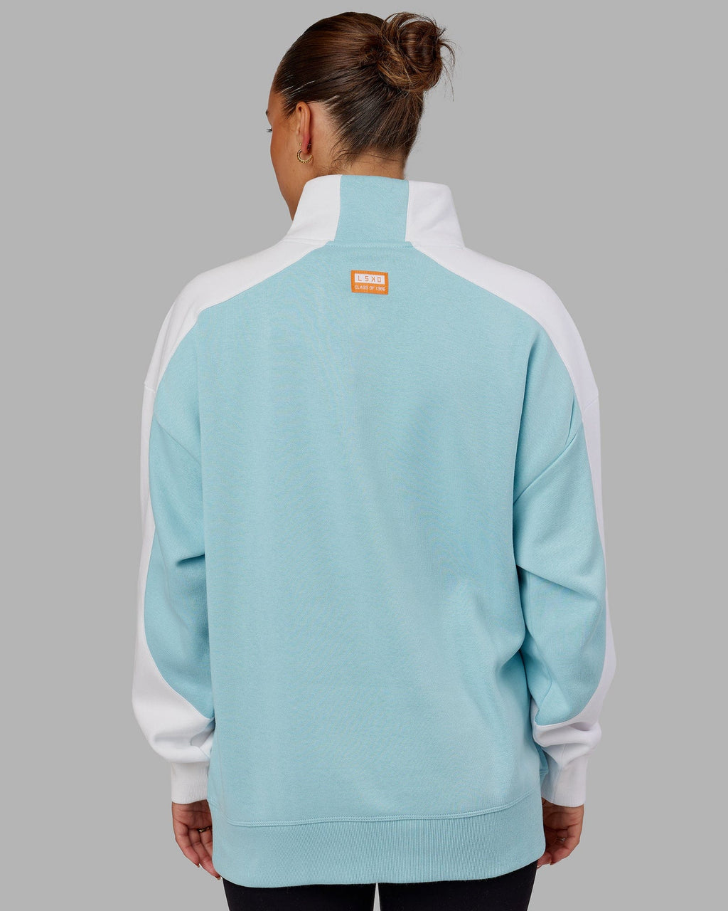 Model wearing Unisex Alumni 1/4 Zip Sweater Oversize - Crystal Blue-Orange Peel
