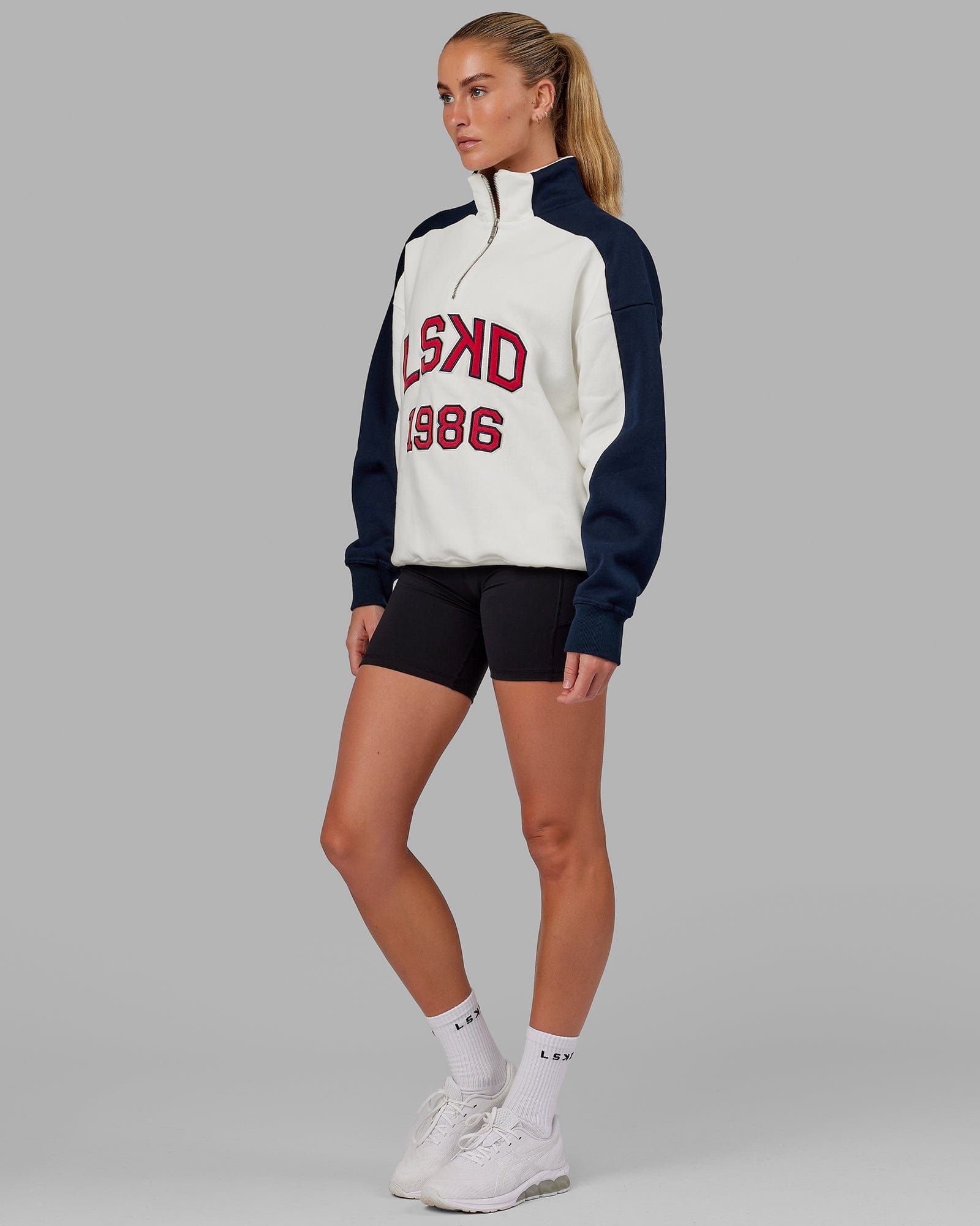 Model wearing Unisex Alumni 1/4 Zip Sweater Oversize - Navy-Red